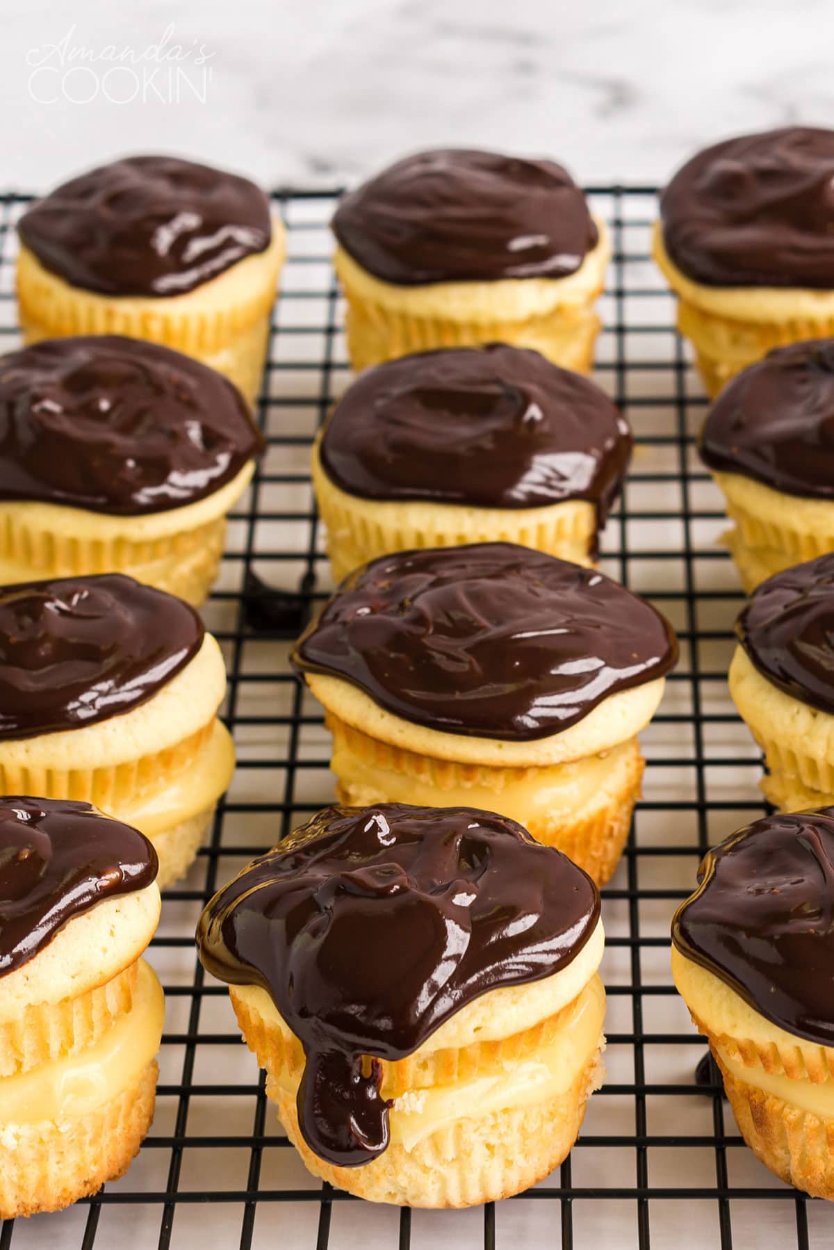 wire rack full of cupcakes