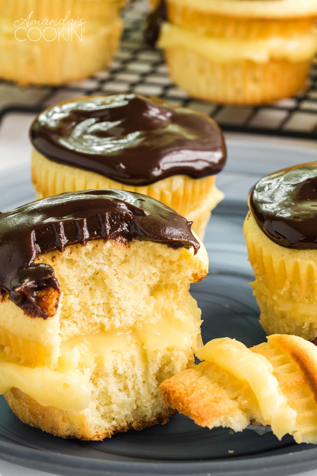 boston cream pie cupcake with a chunk out of it