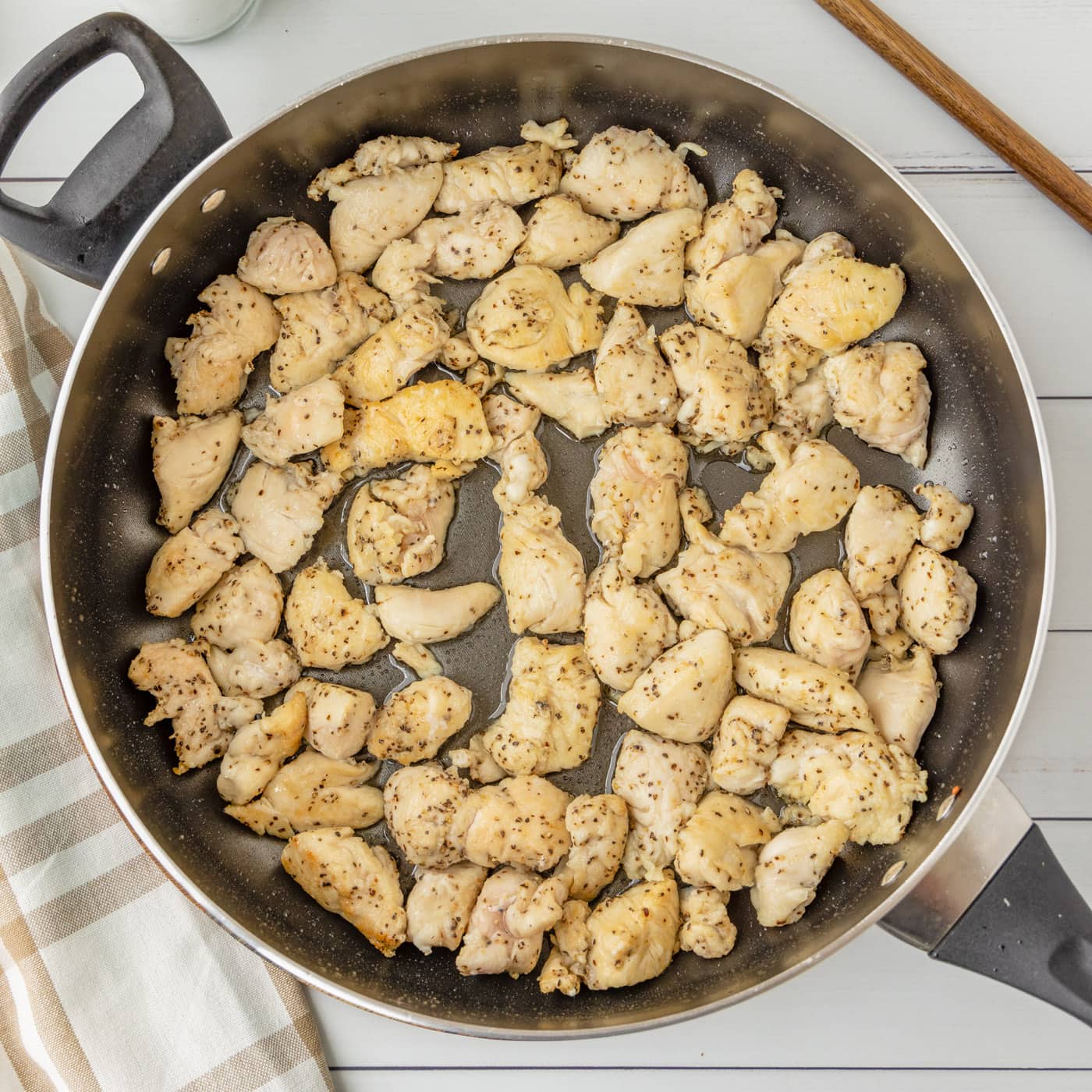 chicken cooking in a skillet