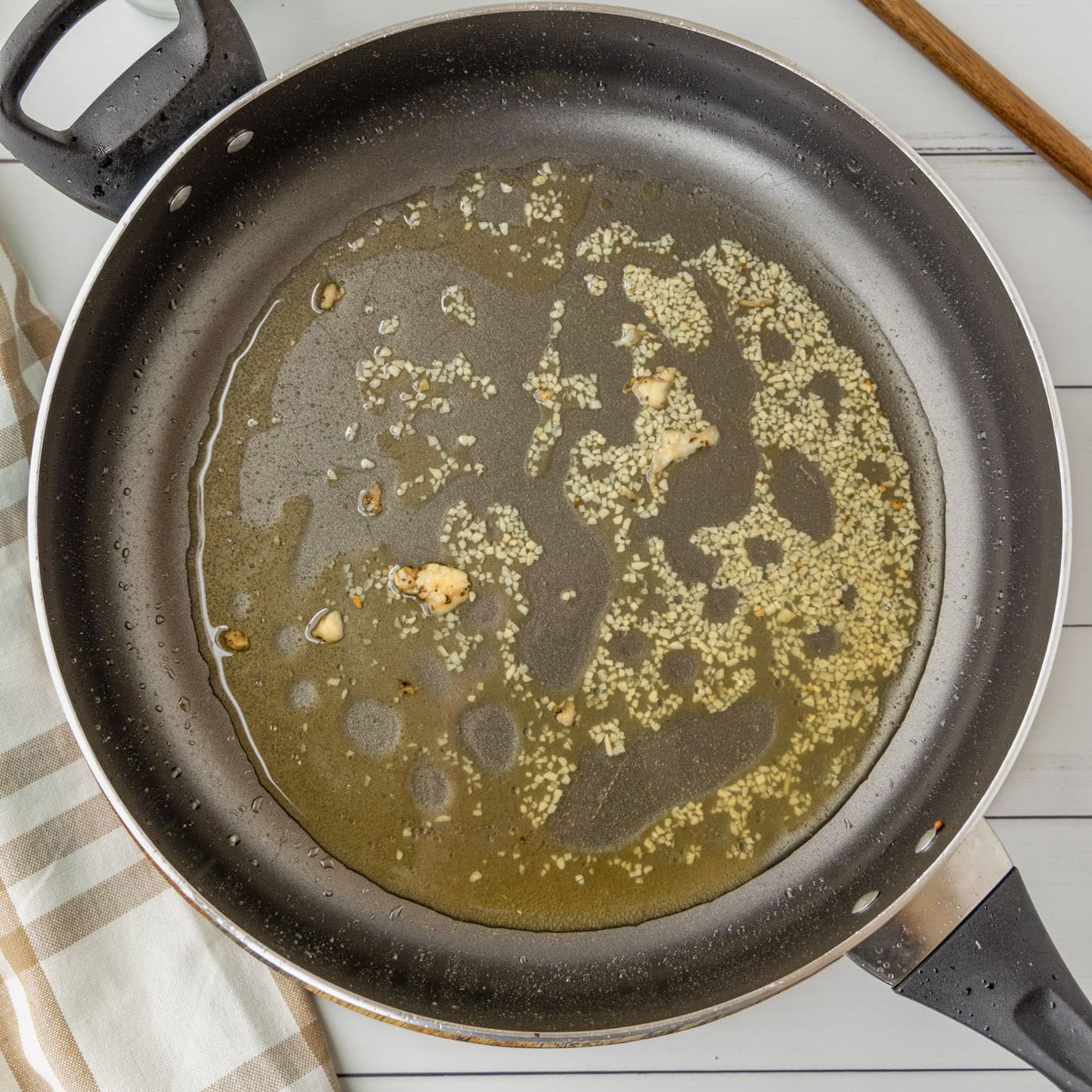 garlic and bourbon in a skillet