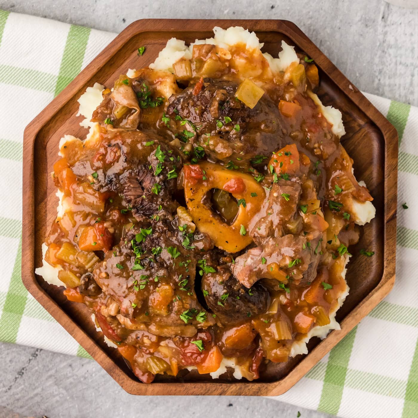 Braised Beef Shanks plated over mashed potatoes