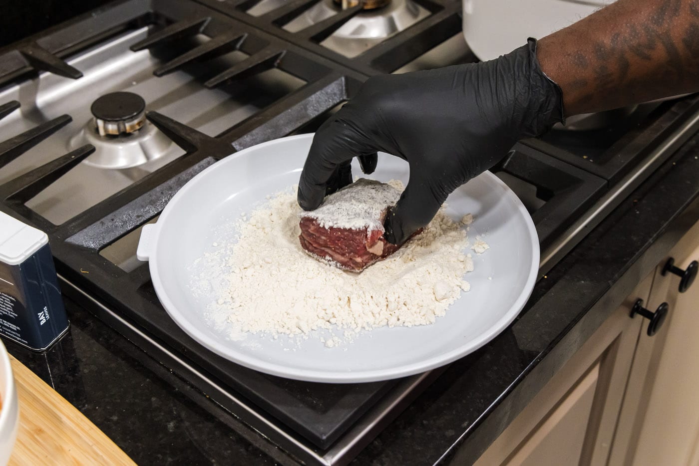 dredging beef short ribs in flour