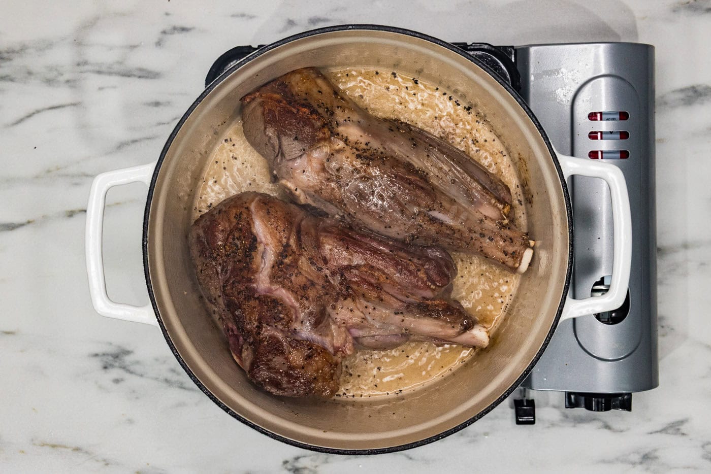 searing lamb shanks in a dutch oven with oil
