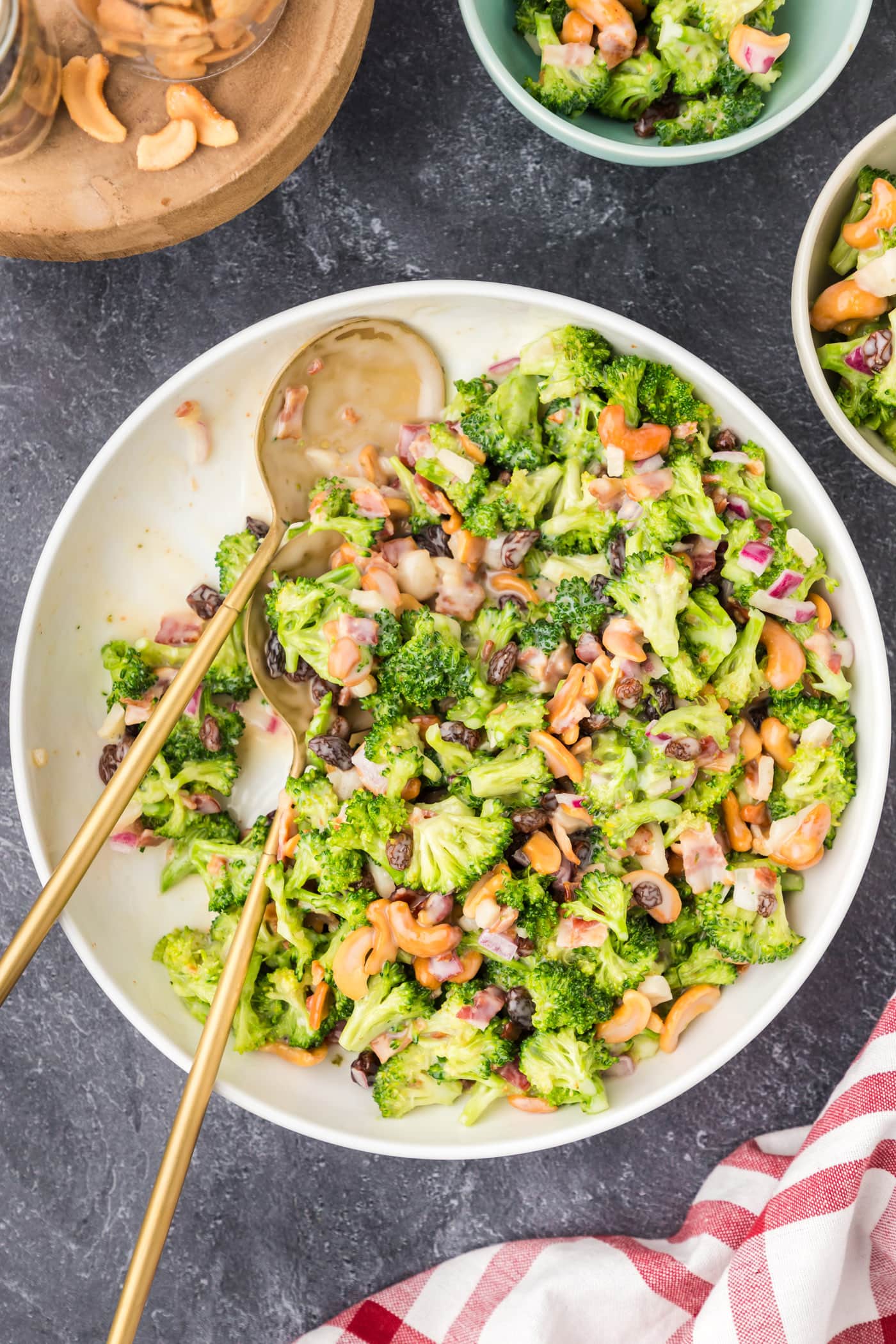 Bowl of Broccoli Cashew Salad with two spoons in it