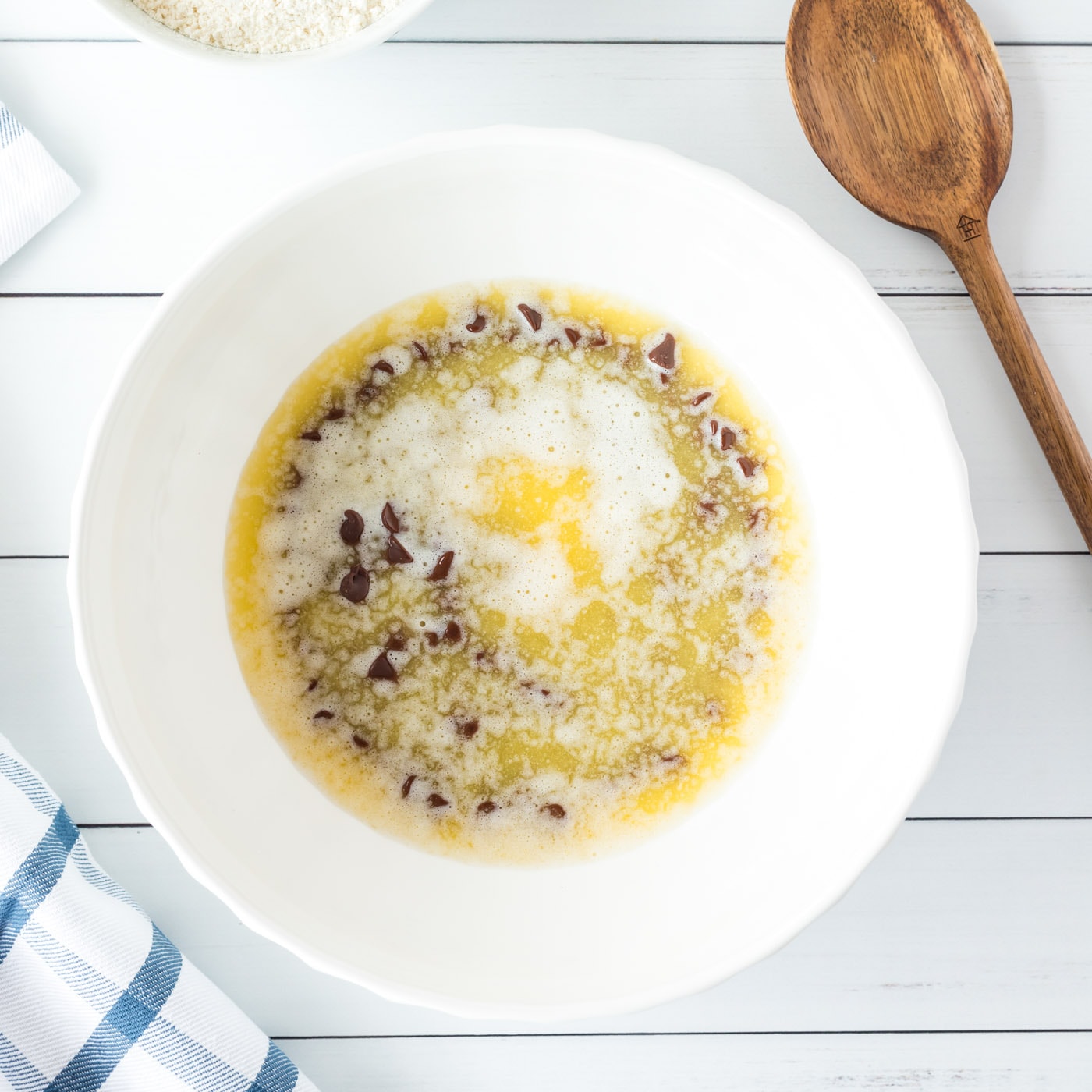 melted butter over chocolate chips in a bowl