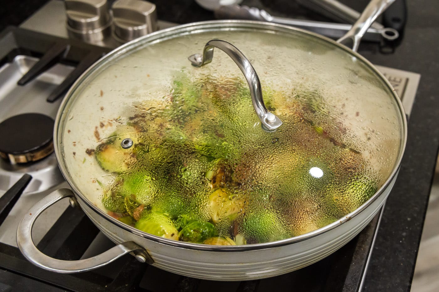 cooking brussels sprouts with bacon, shallots, and candied pecans