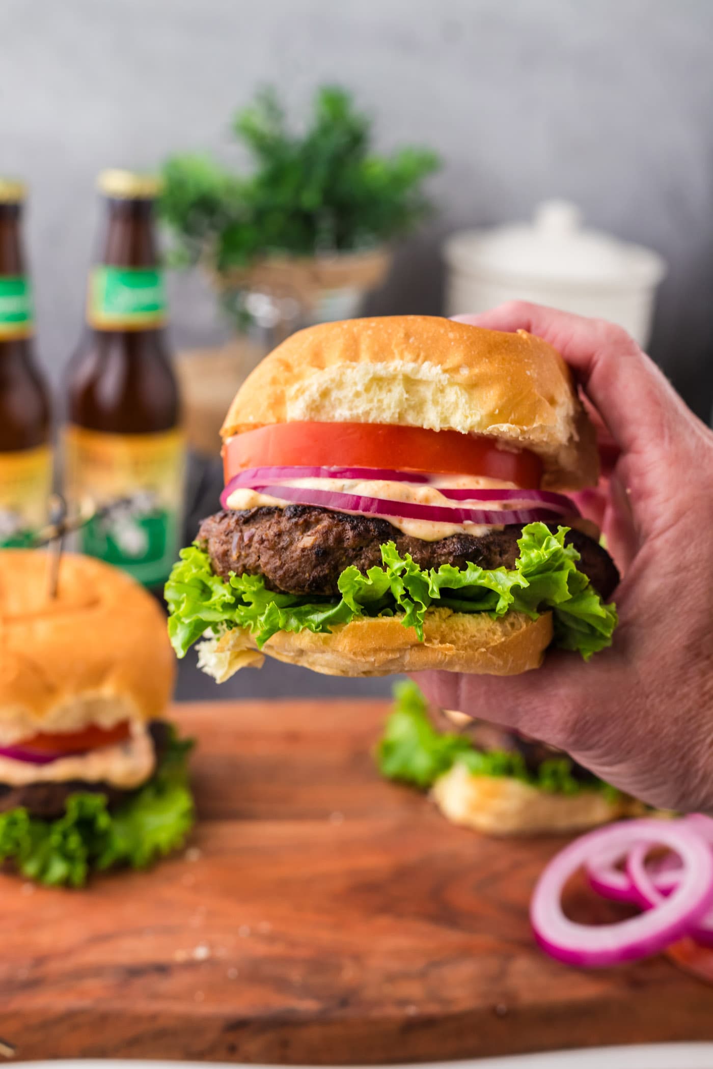 Hand holding up a Buffalo Burger