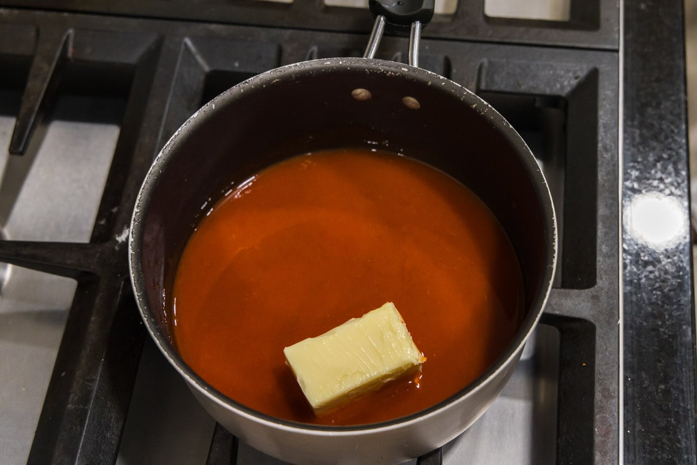 butter and hot sauce in pan
