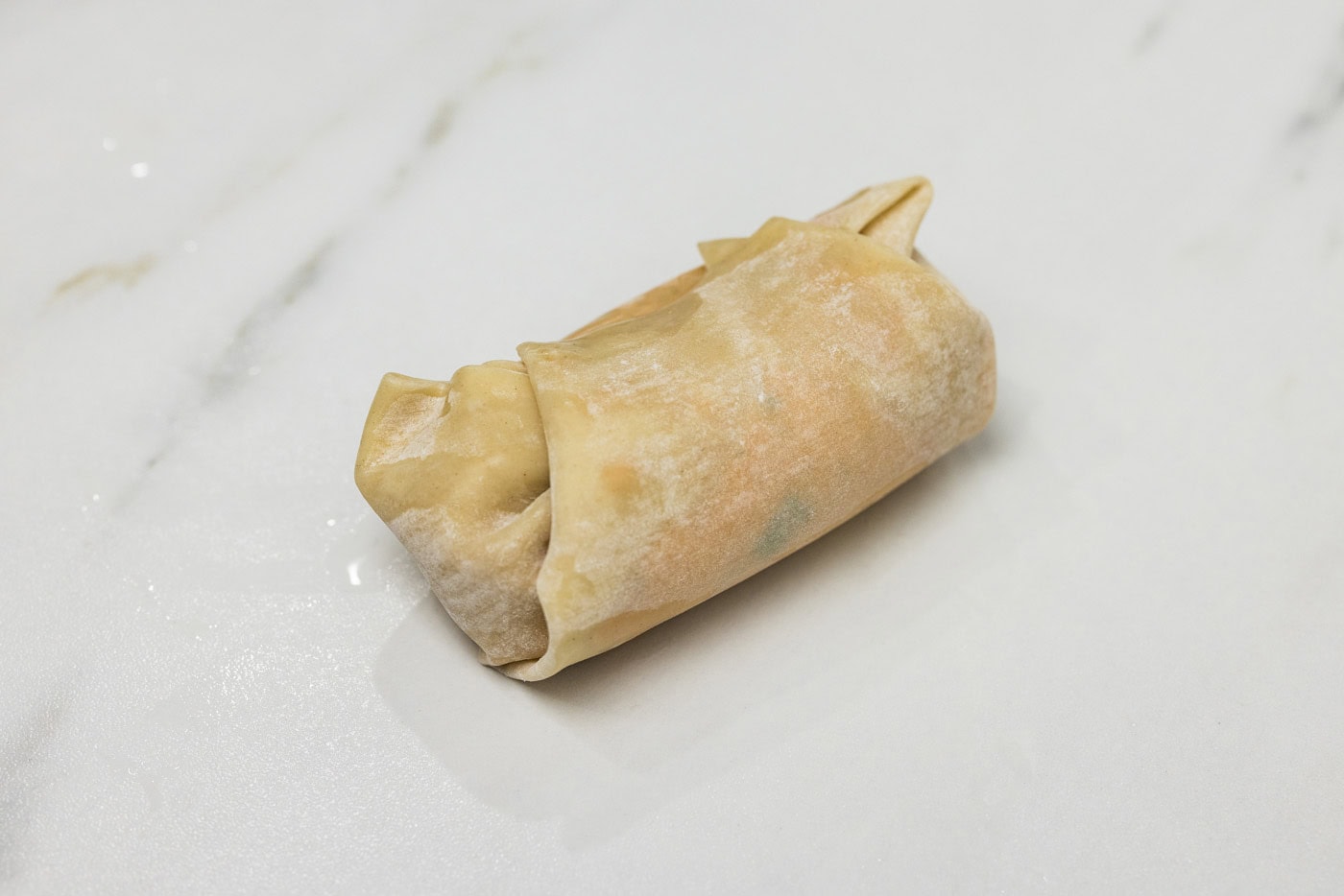 egg roll wrapper with filling sealed