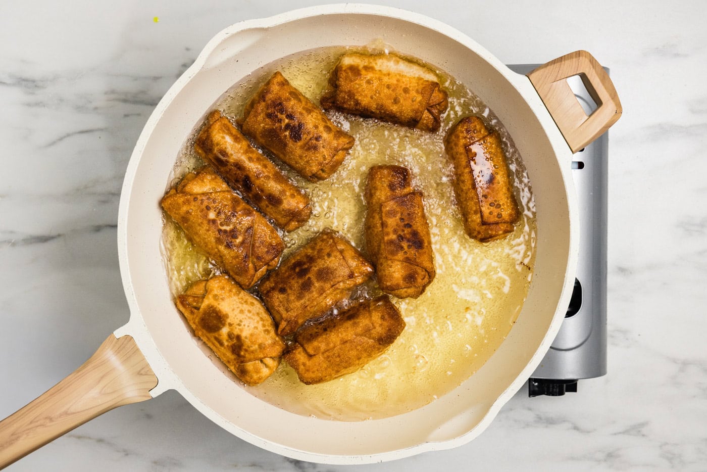 fried buffalo chicken egg rolls in oil