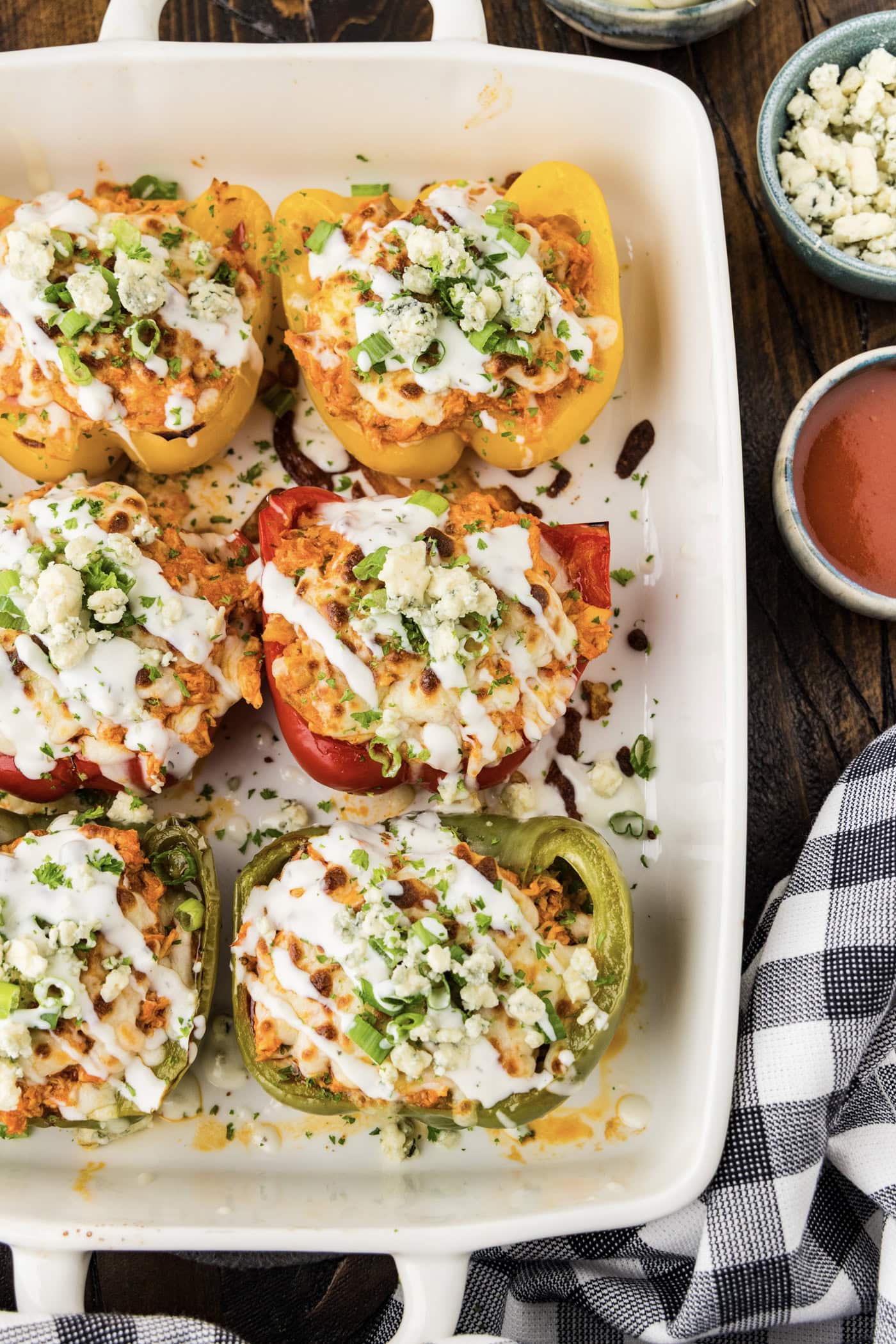 Close up photo of Buffalo Chicken Stuffed Peppers in a baking dish
