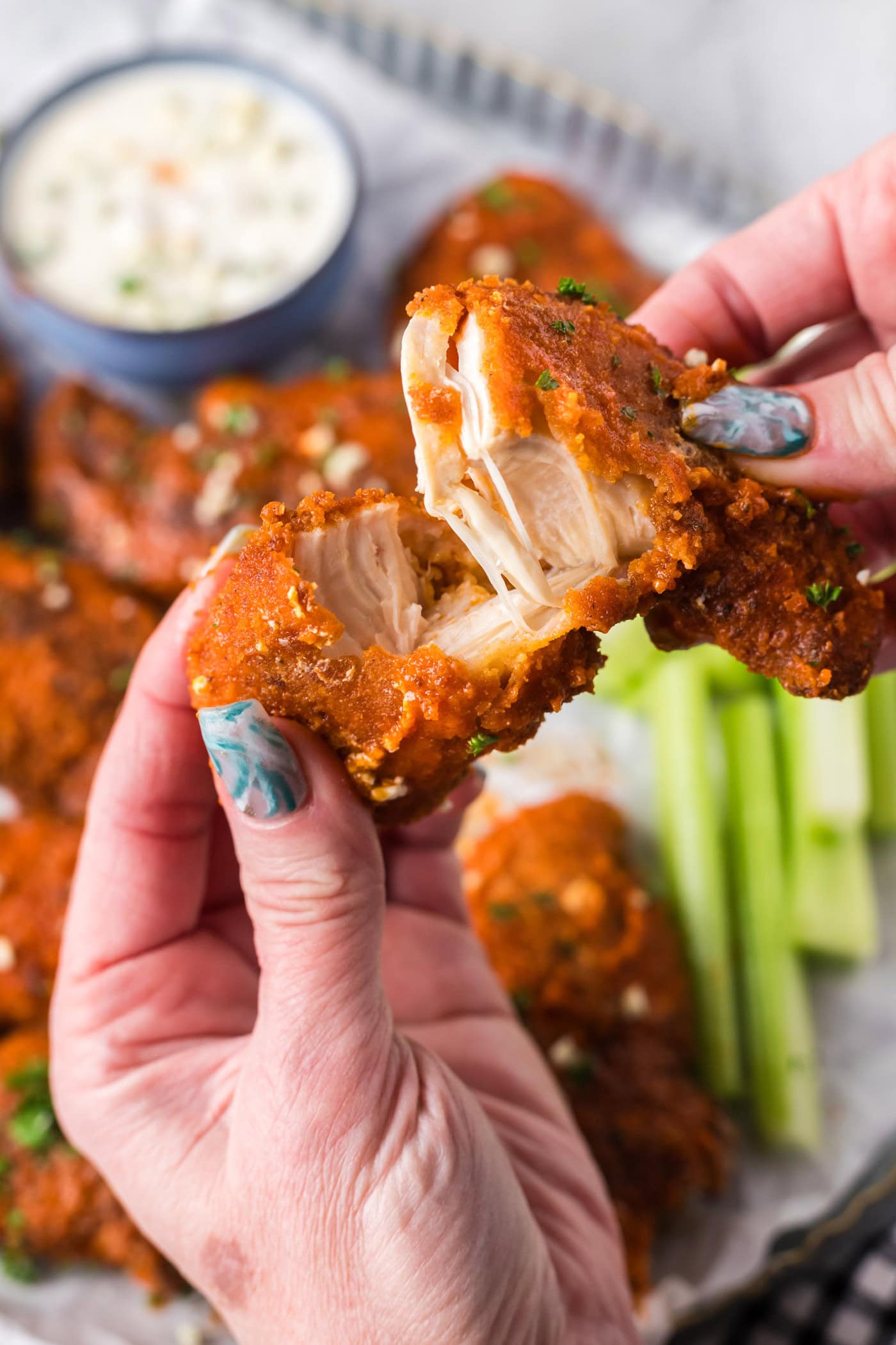 Buffalo Chicken Tender broken in half