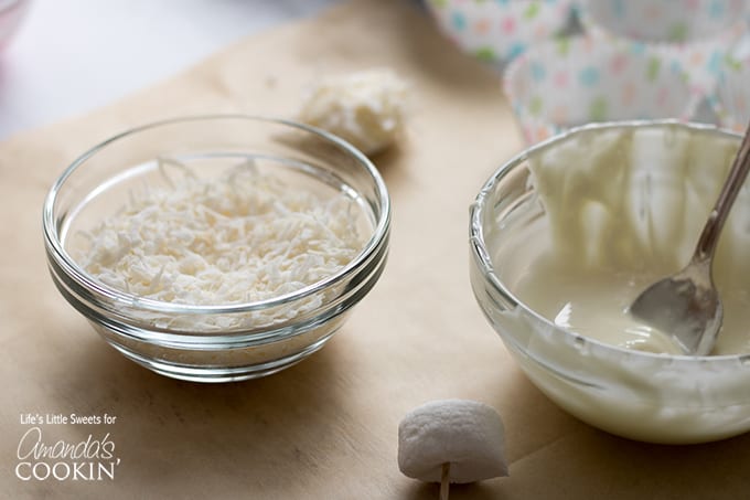 Frosting and coconut flakes in bowl