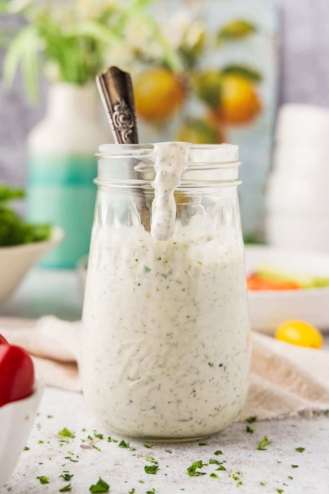 jar of Homemade Buttermilk Ranch Dressing with a spoon in it