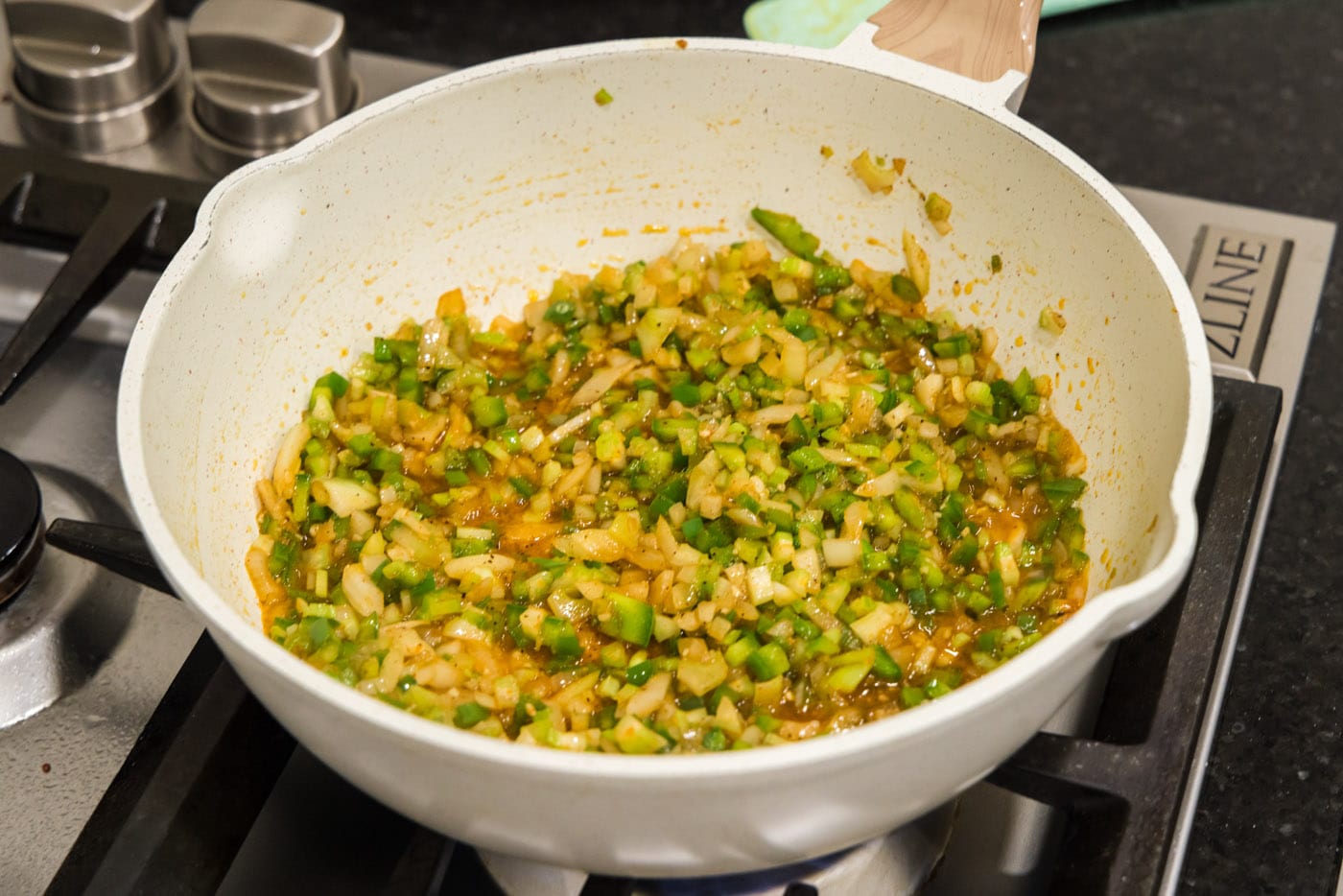 holy trinity vegetables with seasoning in a skillet