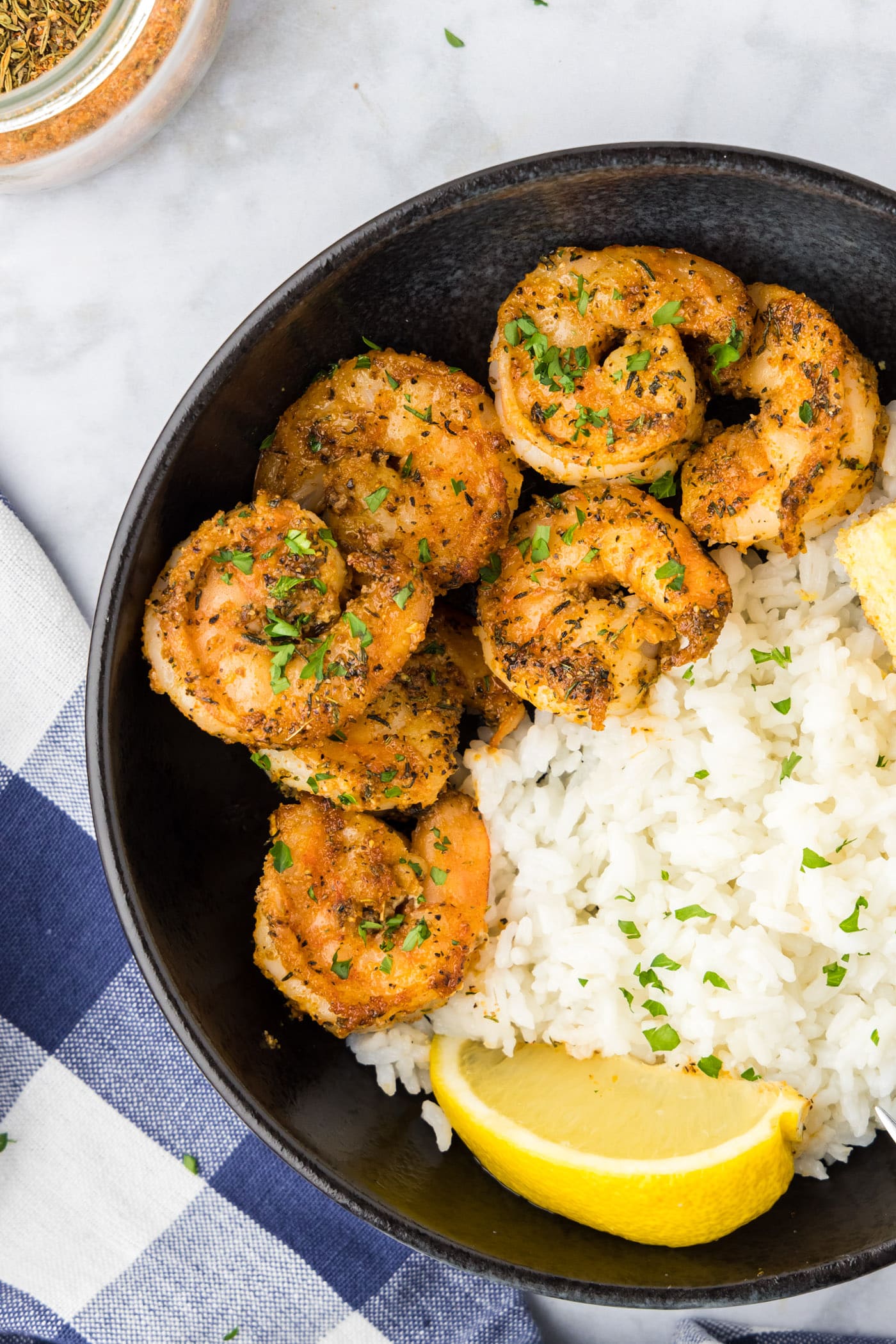 Close up photo of Cajun Shrimp in a bowl with rice