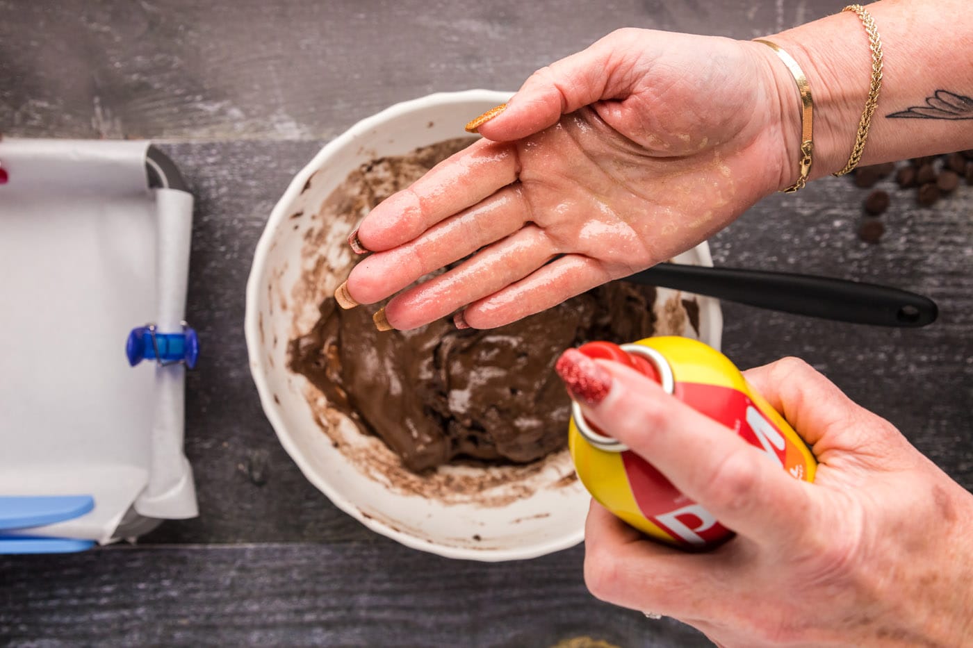 spraying hands with cooking spray