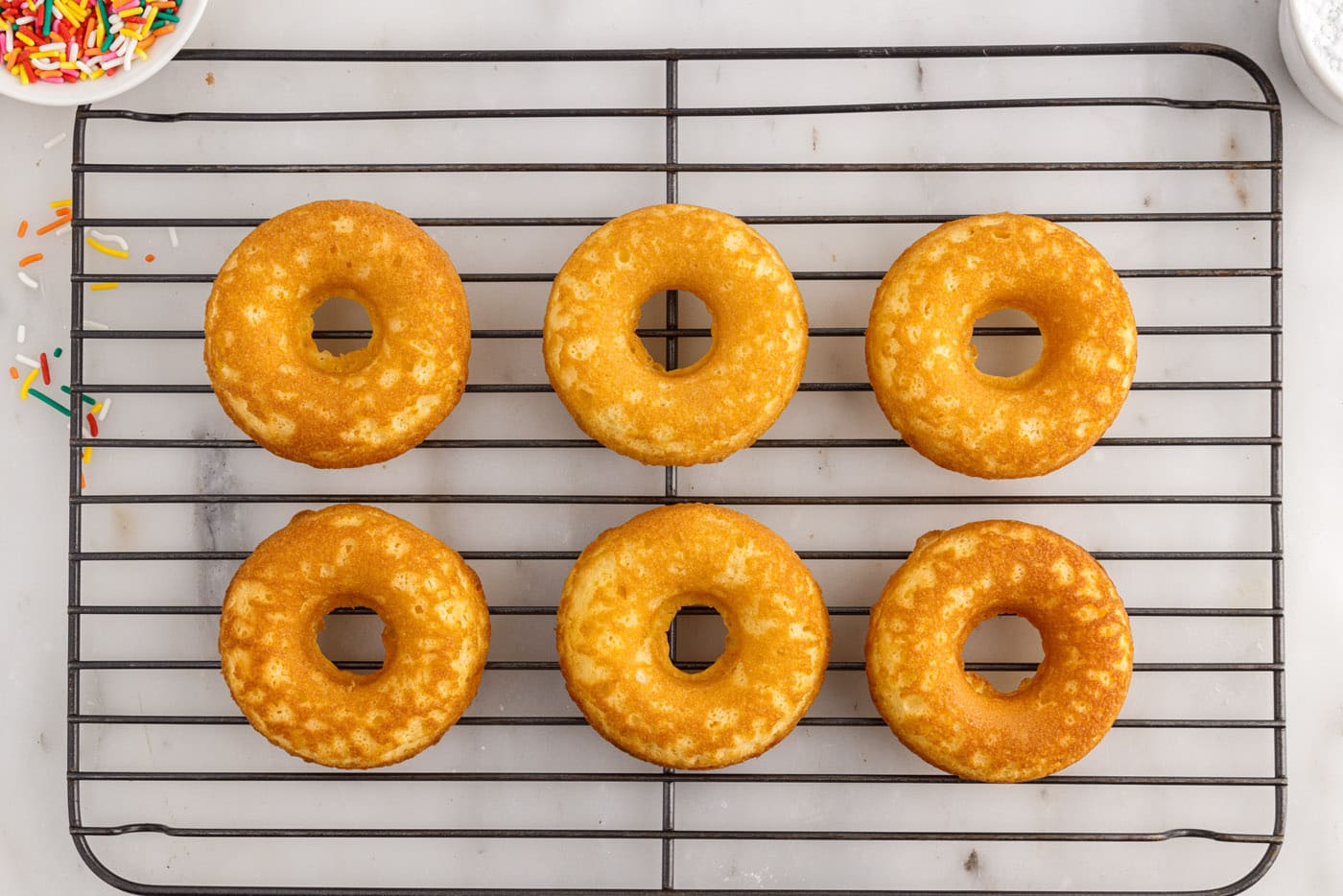 donuts cooling on a wire rack