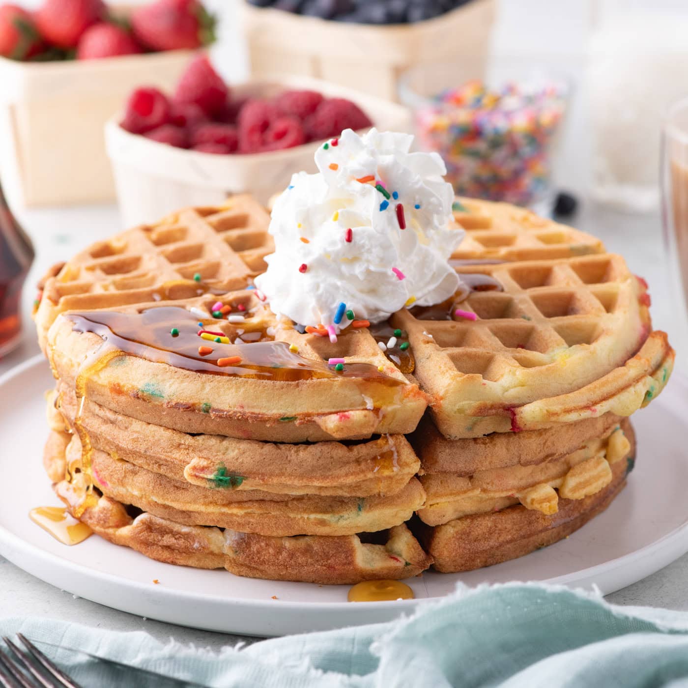 Cake Mix Waffles on a plate topped with whipped cream