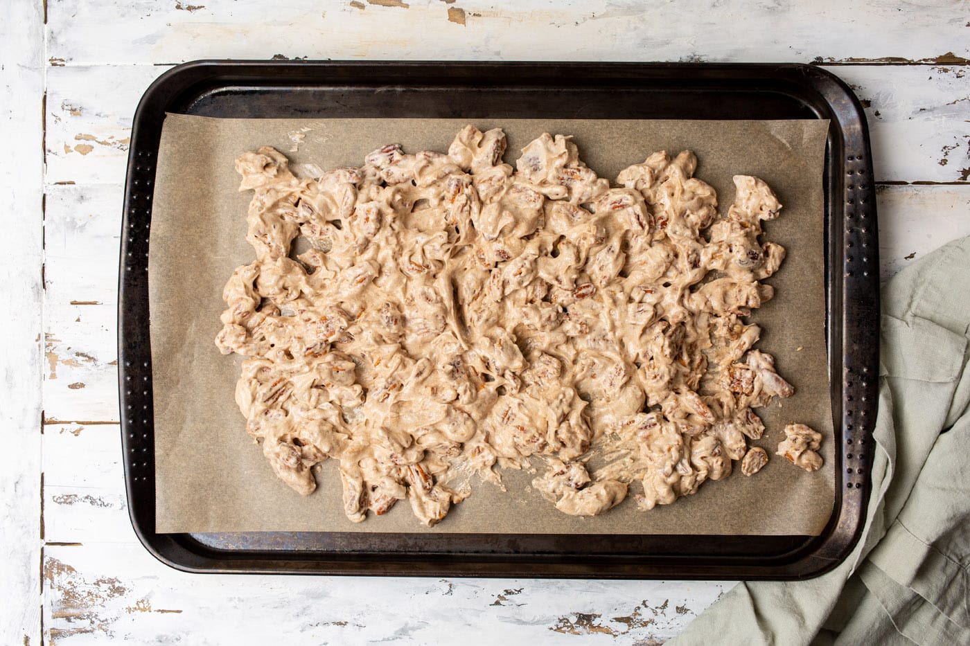 candied pecans on a baking sheet