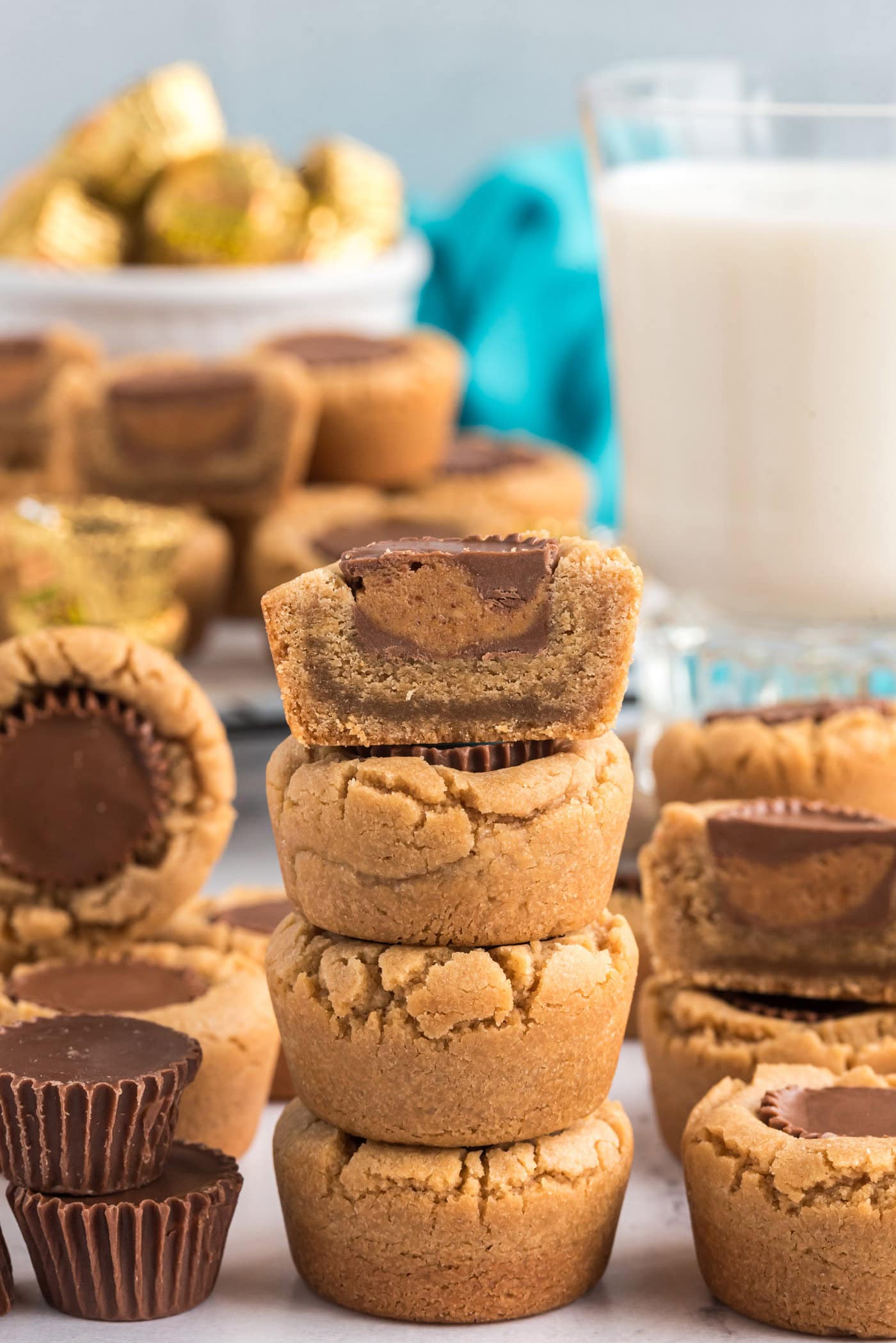 Stack of Reese’s Peanut Butter Cup Cookies with the top cookie cut in half