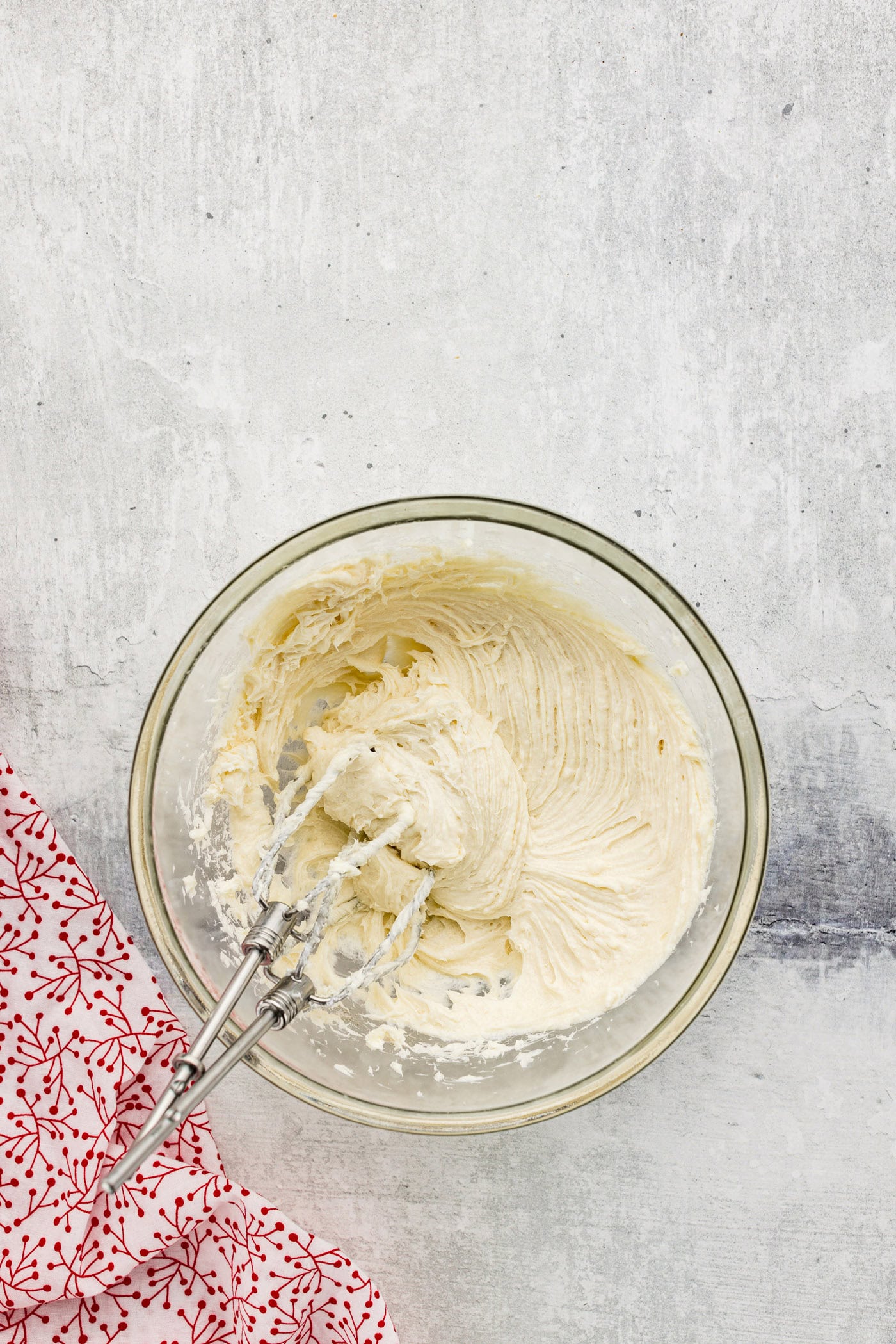 cream cheese, sugar, and vanilla beaten with a hand mixer in a bowl