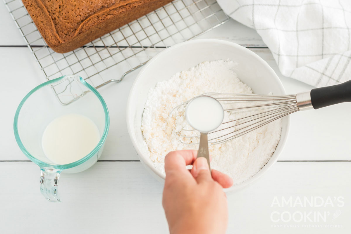 adding milk to powdered sugar