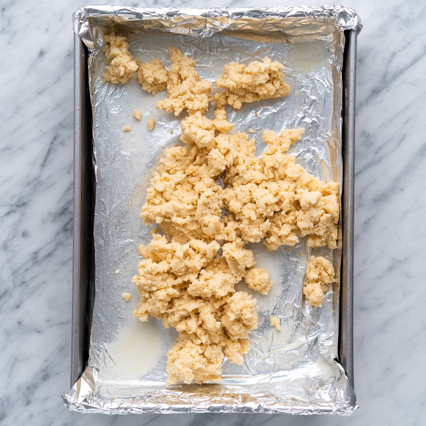 shortbread crust on top of a baking pan