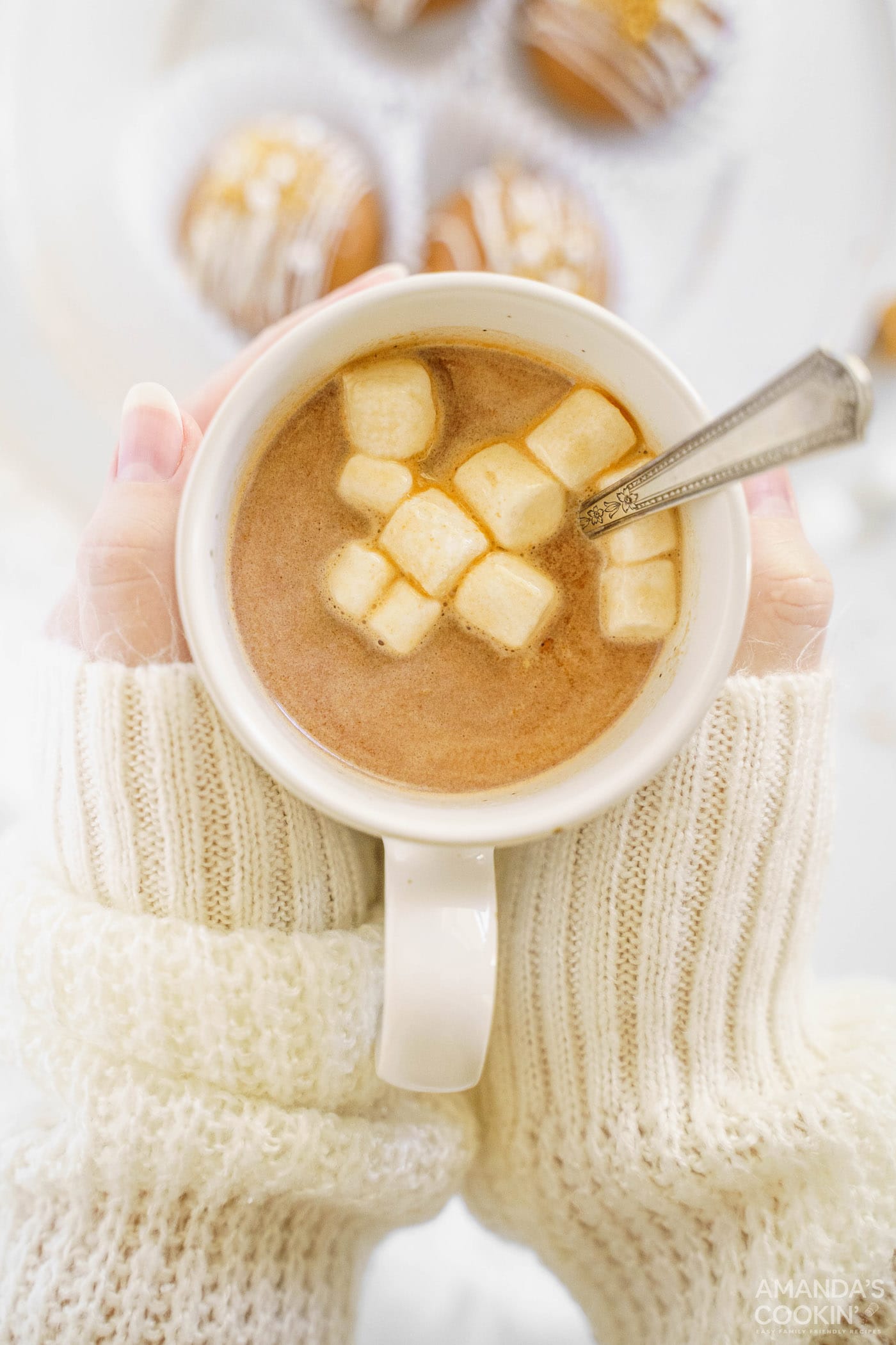 woman holding mug of hot cocoa
