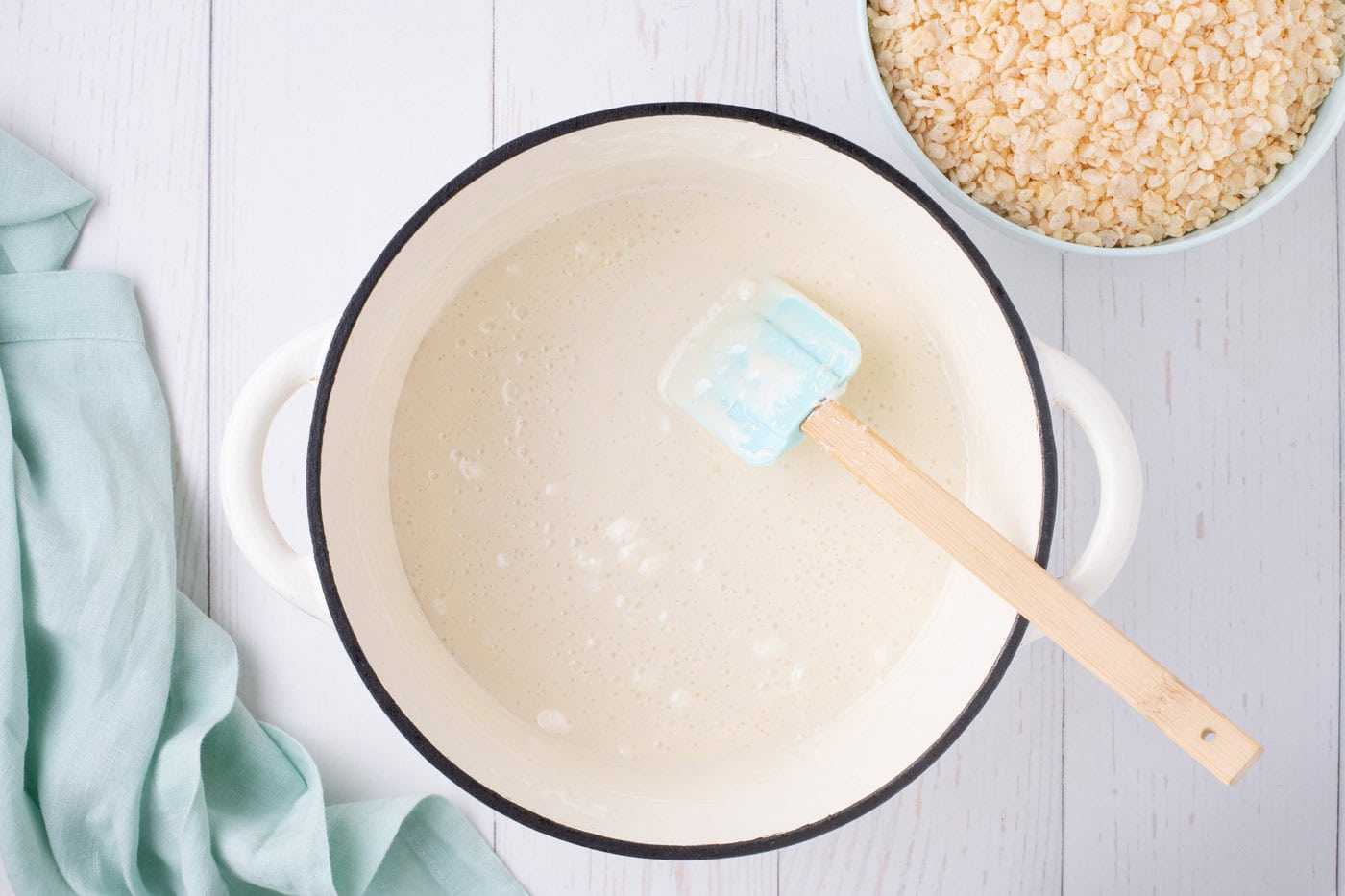 melted marshmallows in a pot with a rubber spatula