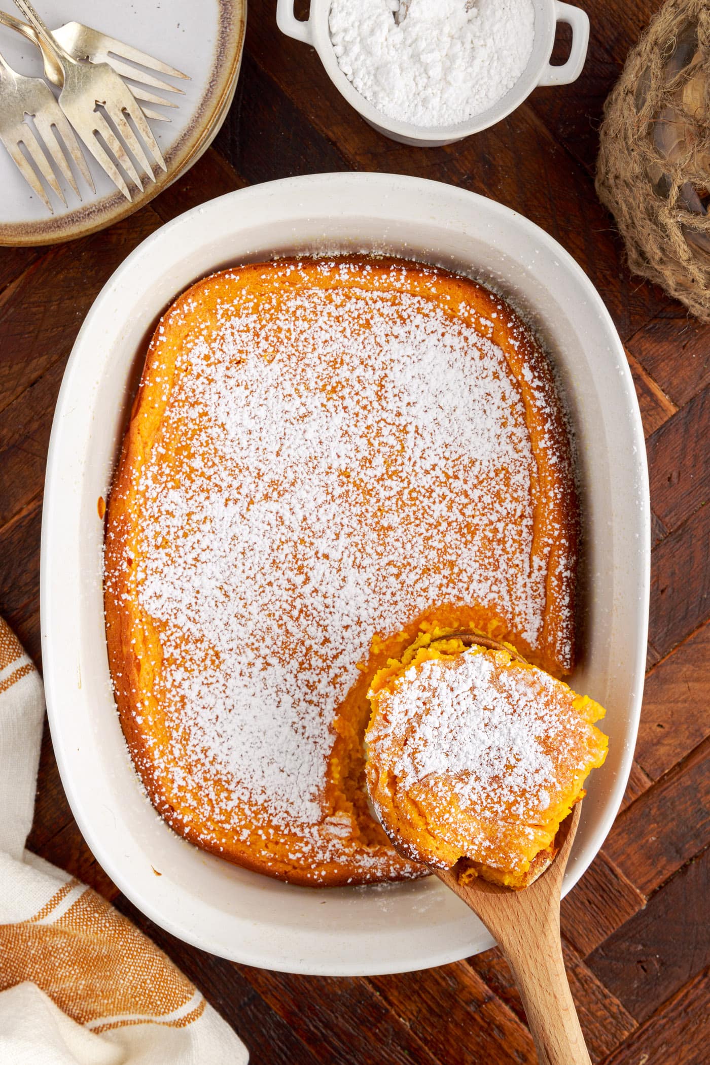 Serving of Carrot Souffle being removed from the dish by a spoon