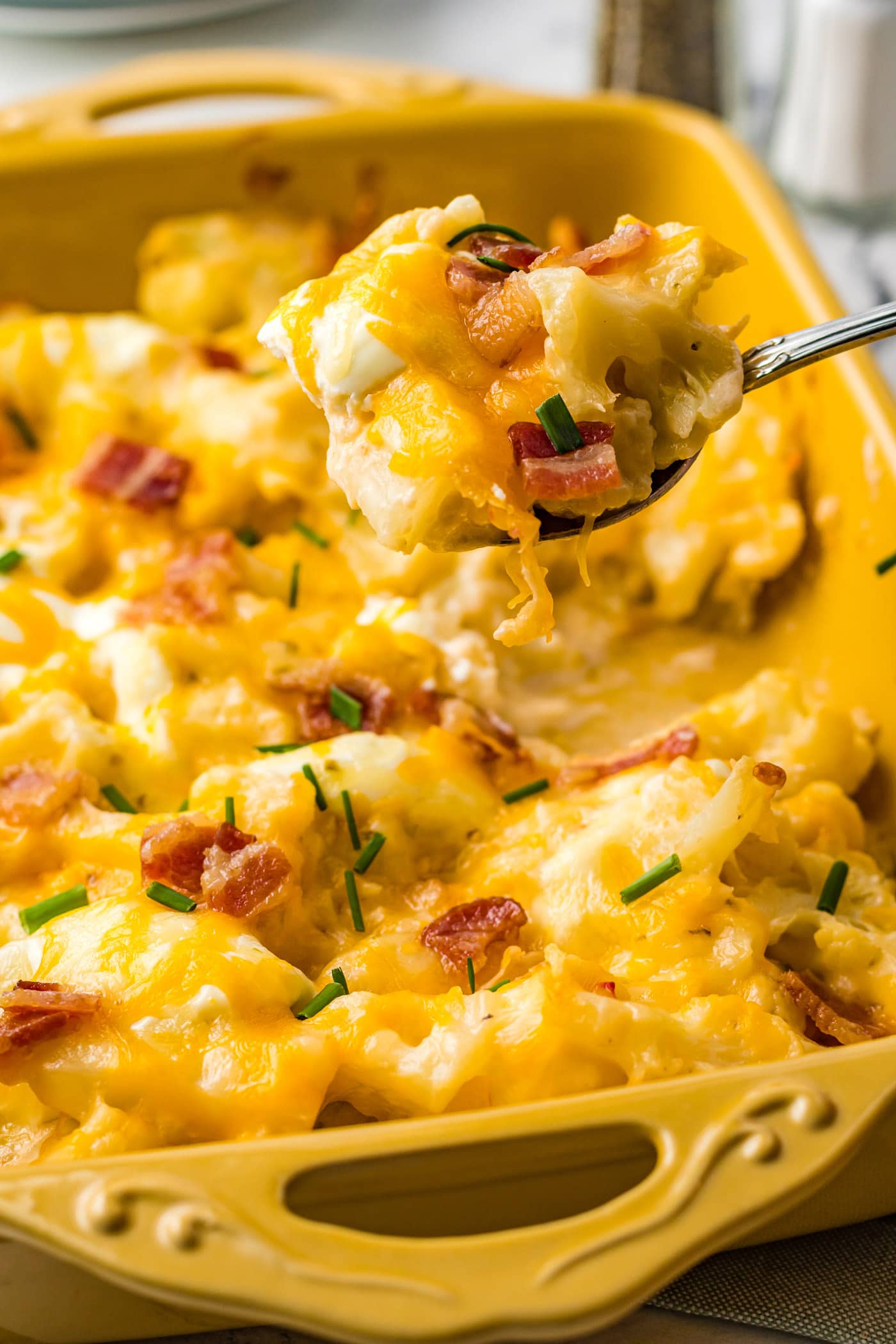 serving out Cauliflower Casserole