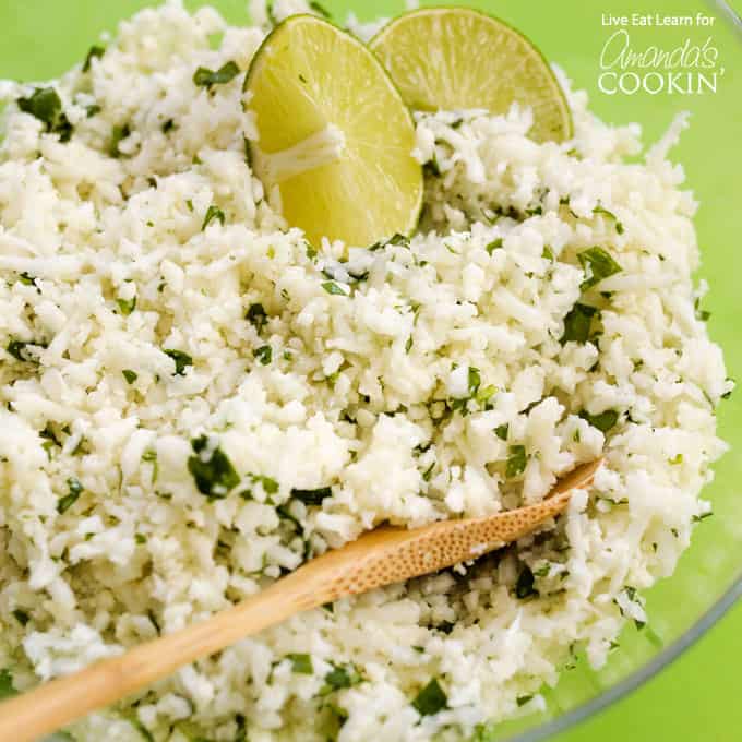 bowl of cauliflower chipotle rice with wooden spoon