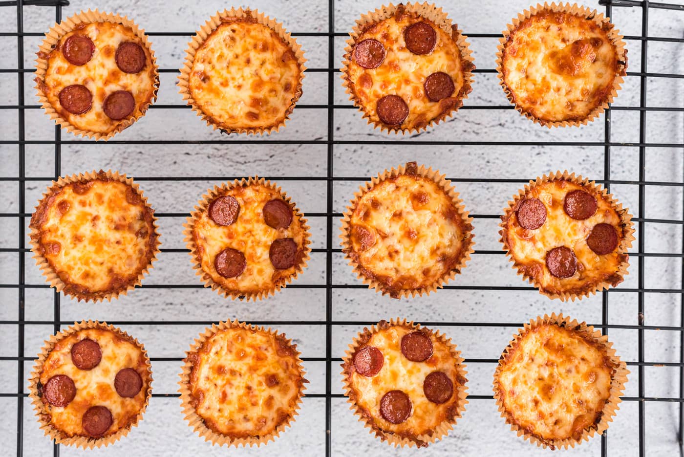 baked cauliflower pizza bites on a cooling rack