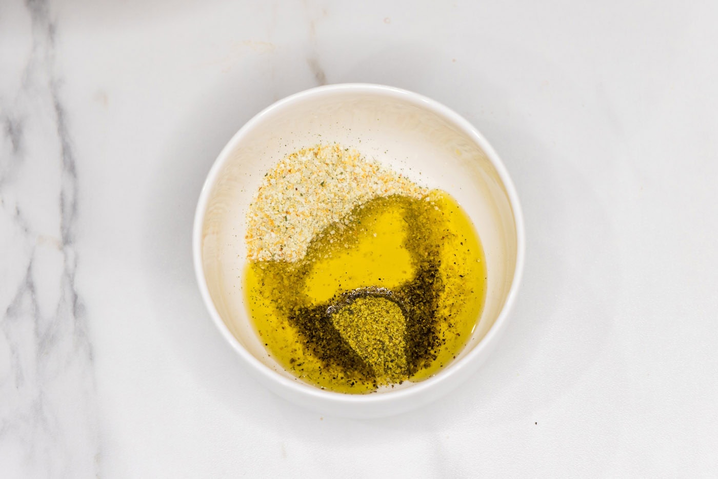 oliev oil and seasonins in a bowl