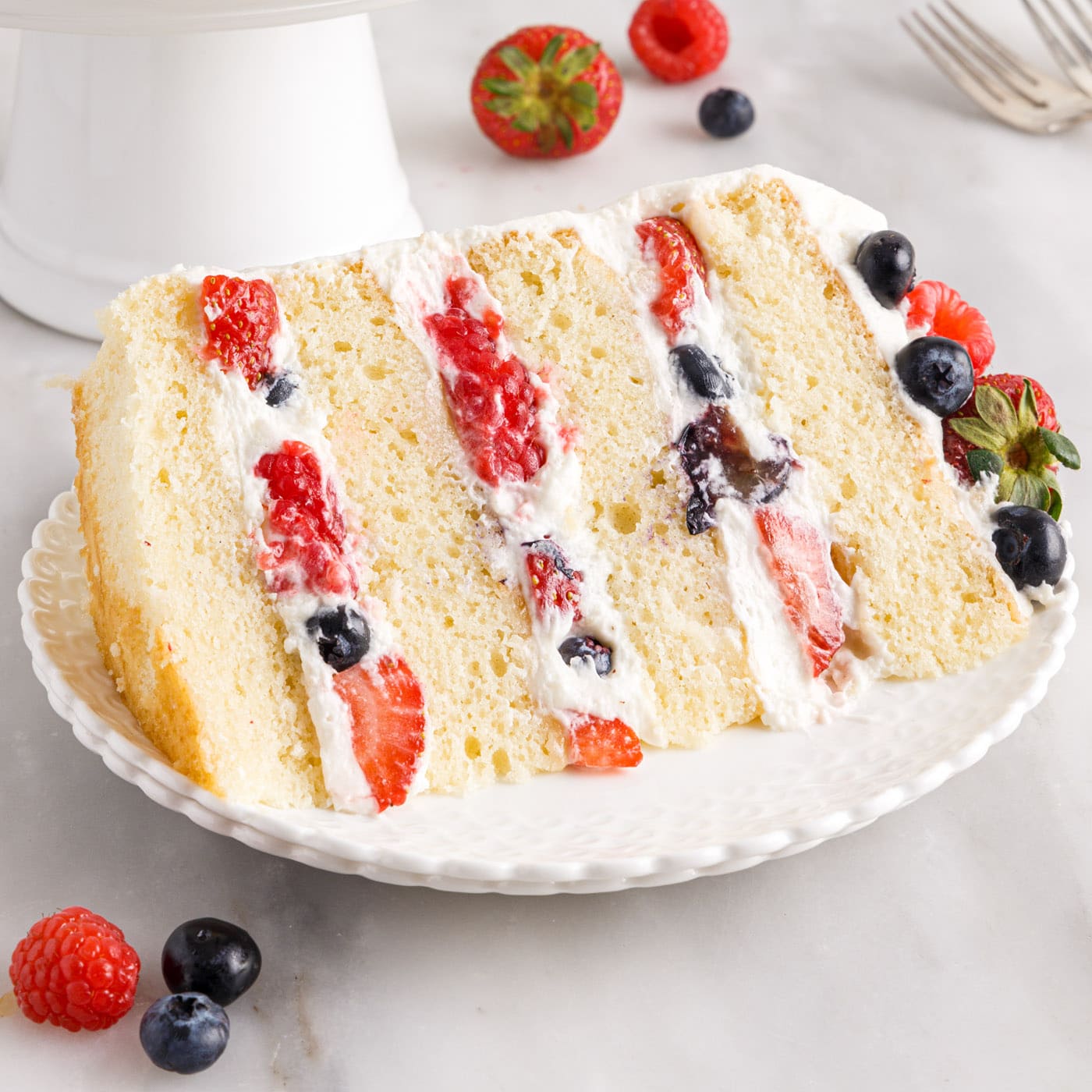 slice of Chantilly Cake on plate