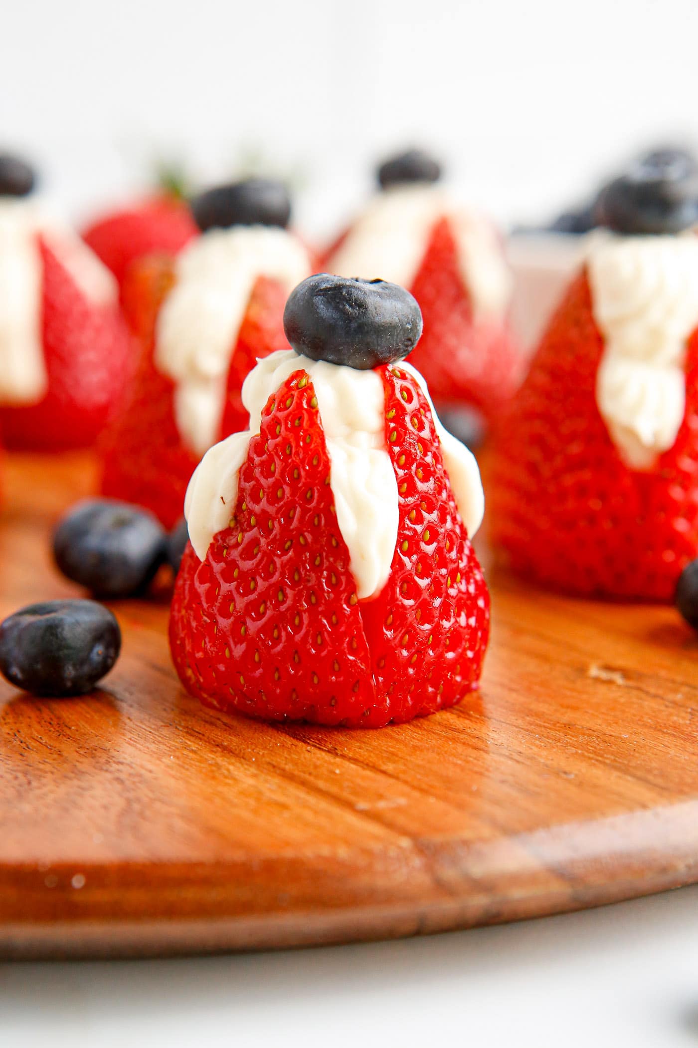Cheesecake Stuffed Strawberries with a blueberry on top