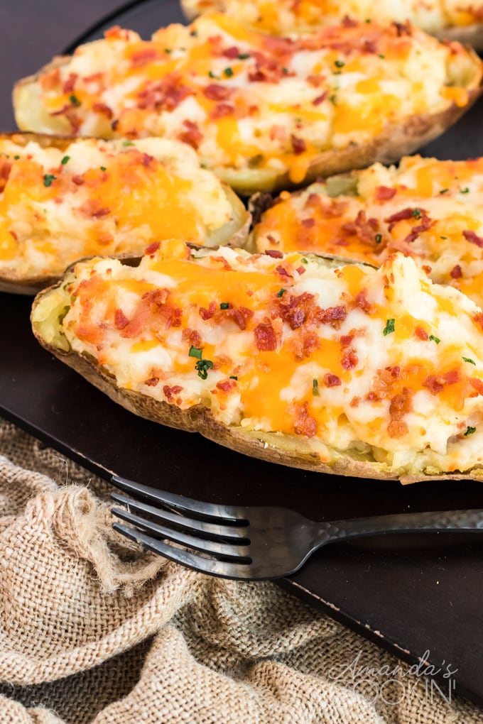 twice baked potatoes on a black board