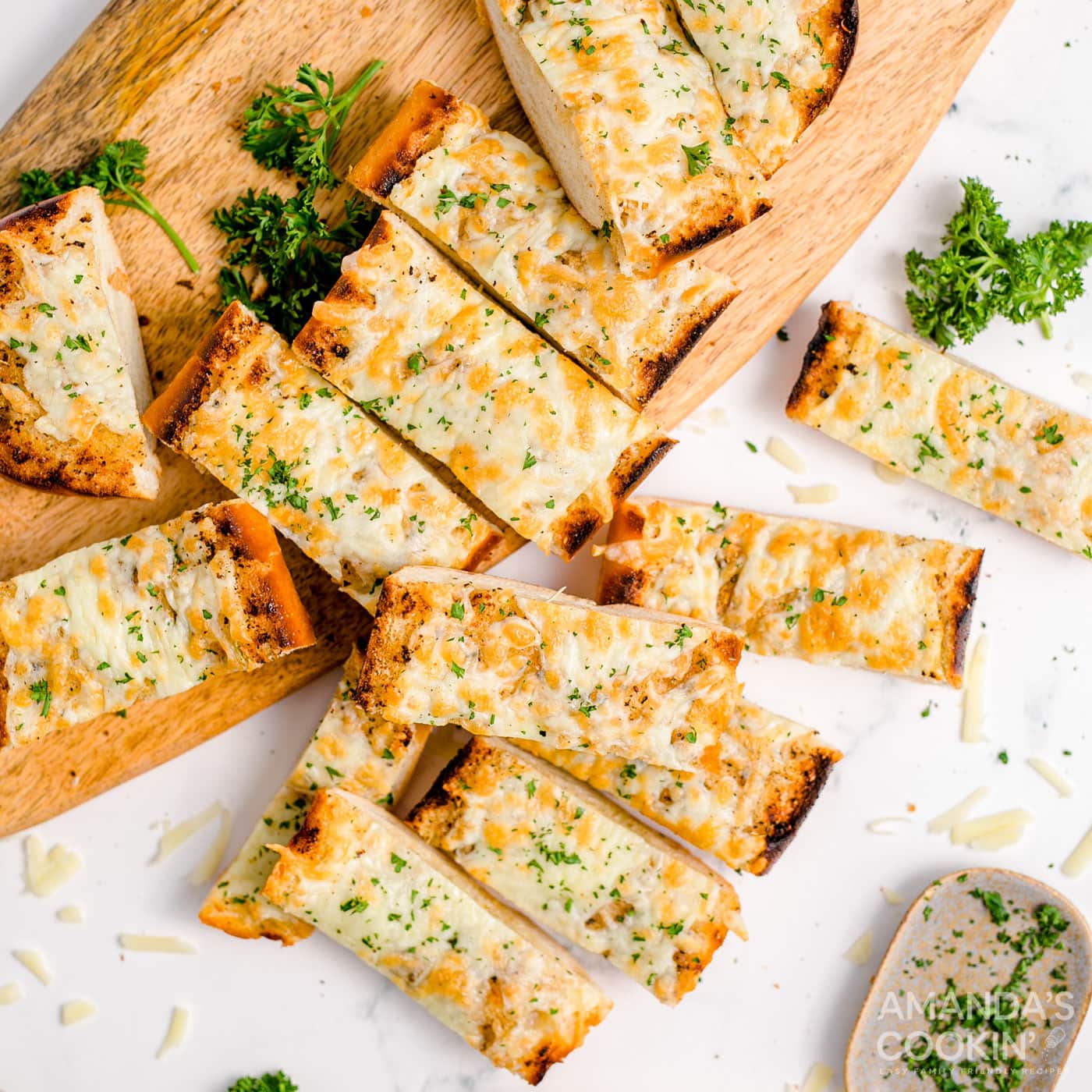 sliced garlic bread on a cutting board