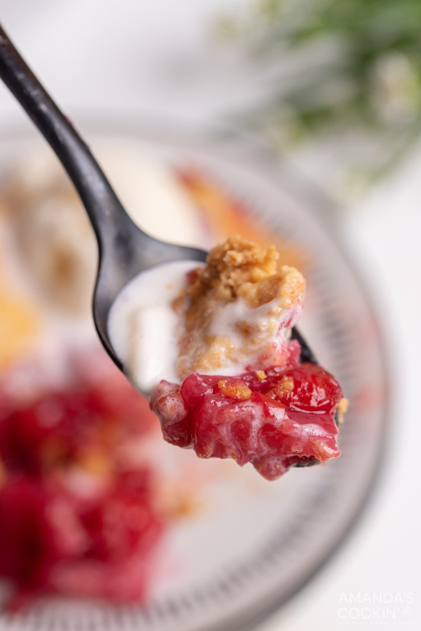 spoon of Cherry Pineapple Dump Cake
