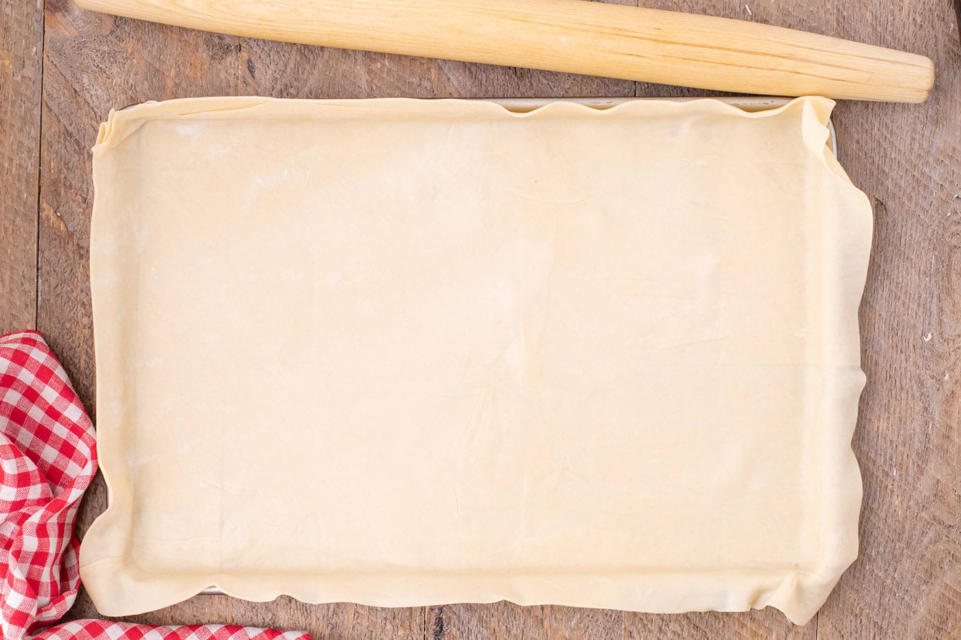 pie crust placed in a jelly roll pan
