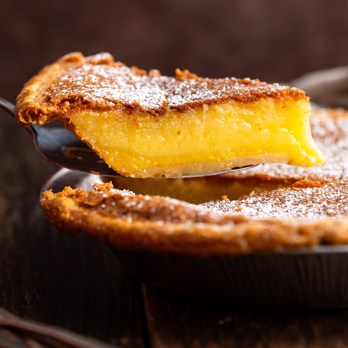 Slice of Chess Pie being lifted out of the pie