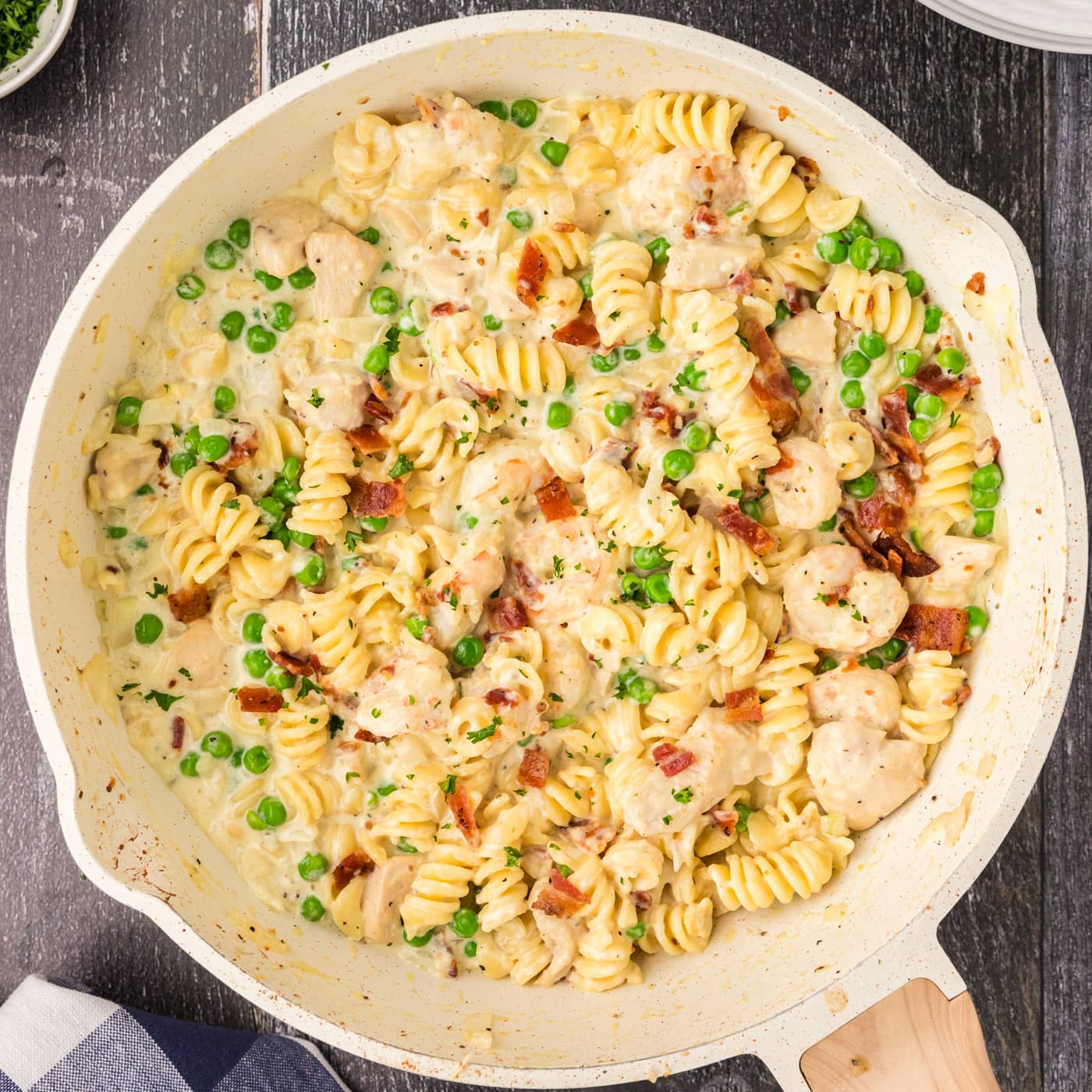 Close up photo of a skillet of Chicken and Shrimp Carbonara