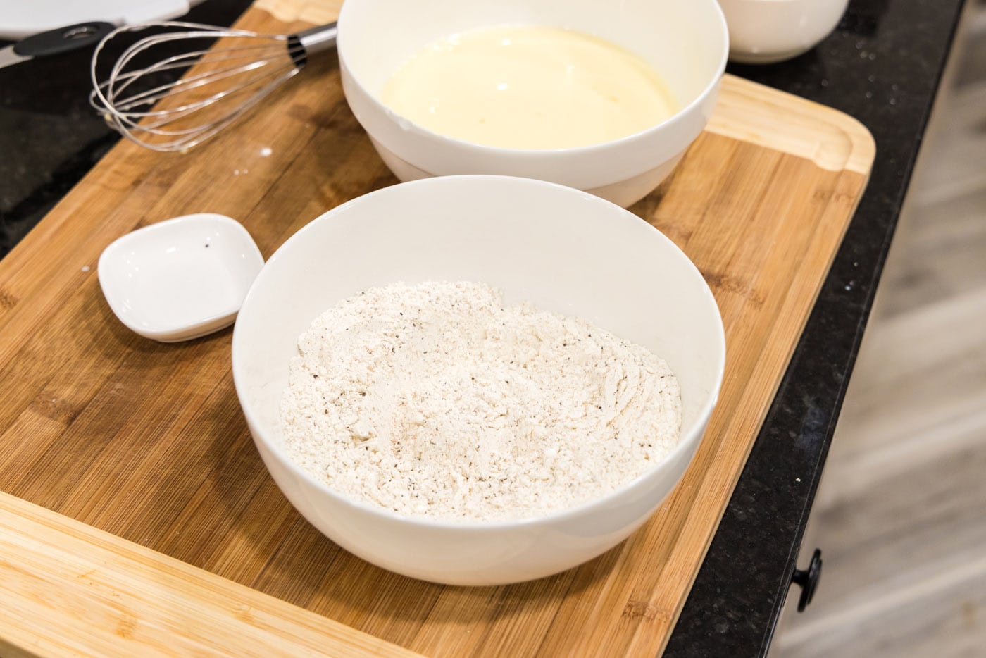 flour, cornstarch, Slap Ya Mama seasoning, garlic salt, and black pepper in a bowl