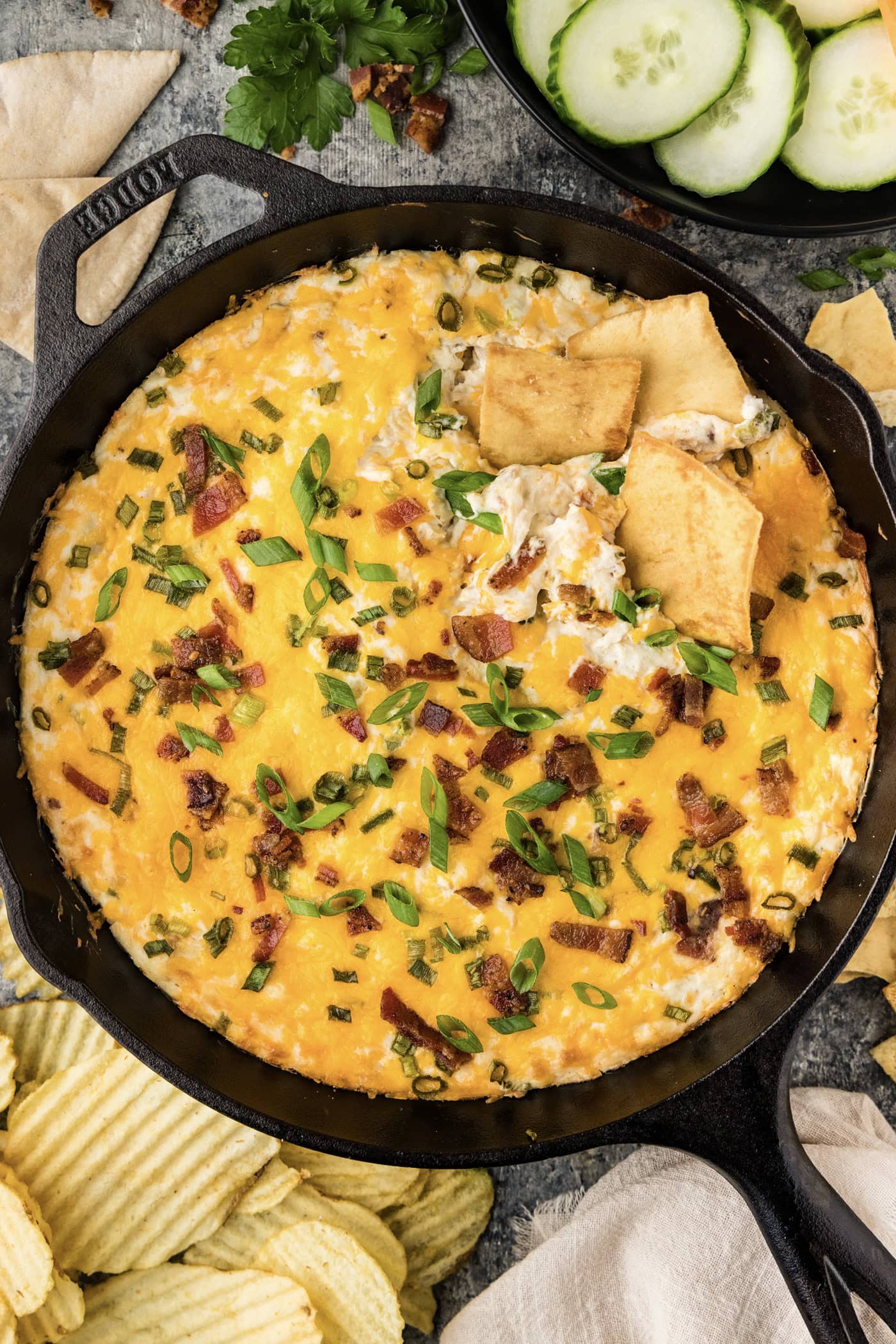 Skillet of Chicken Bacon Ranch Dip with chips in it