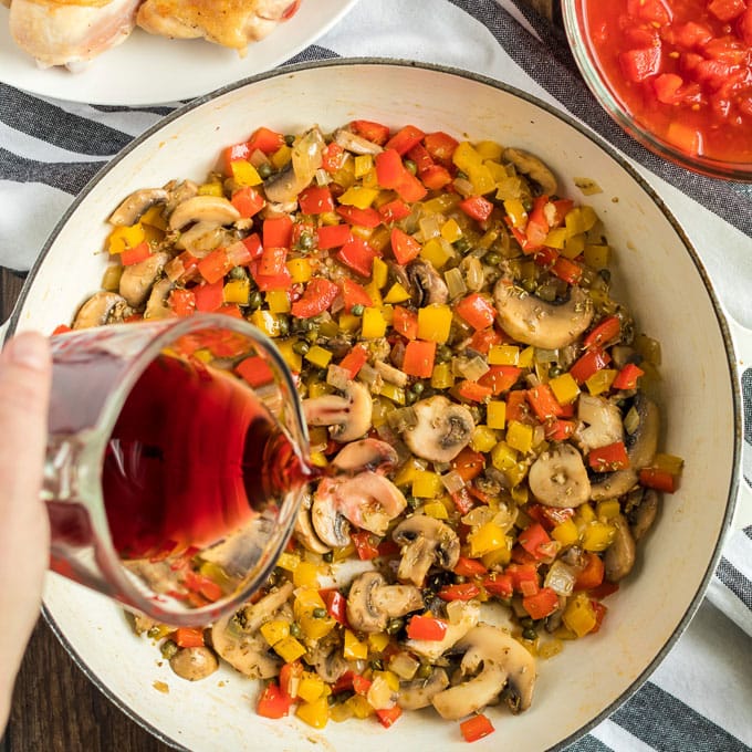 Pouring wine into the skillet