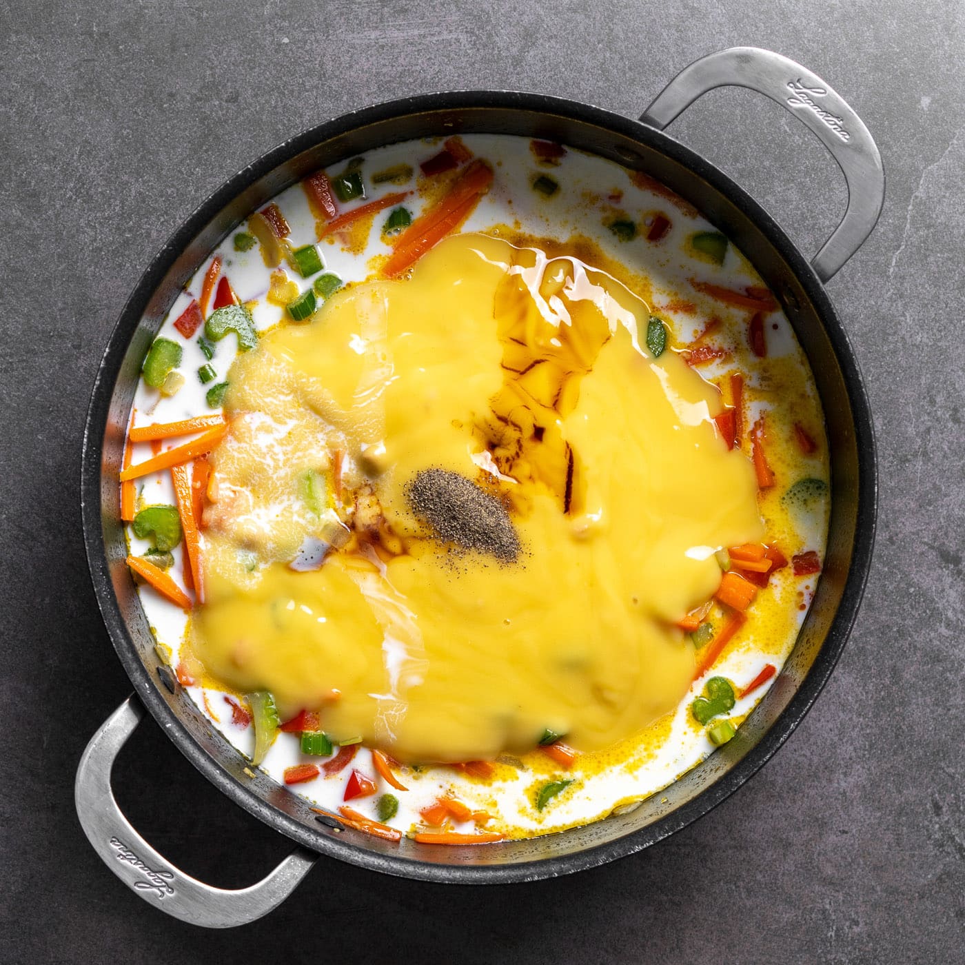 cream of chicken soup with seasoning and soy sauce over sauteed veggies