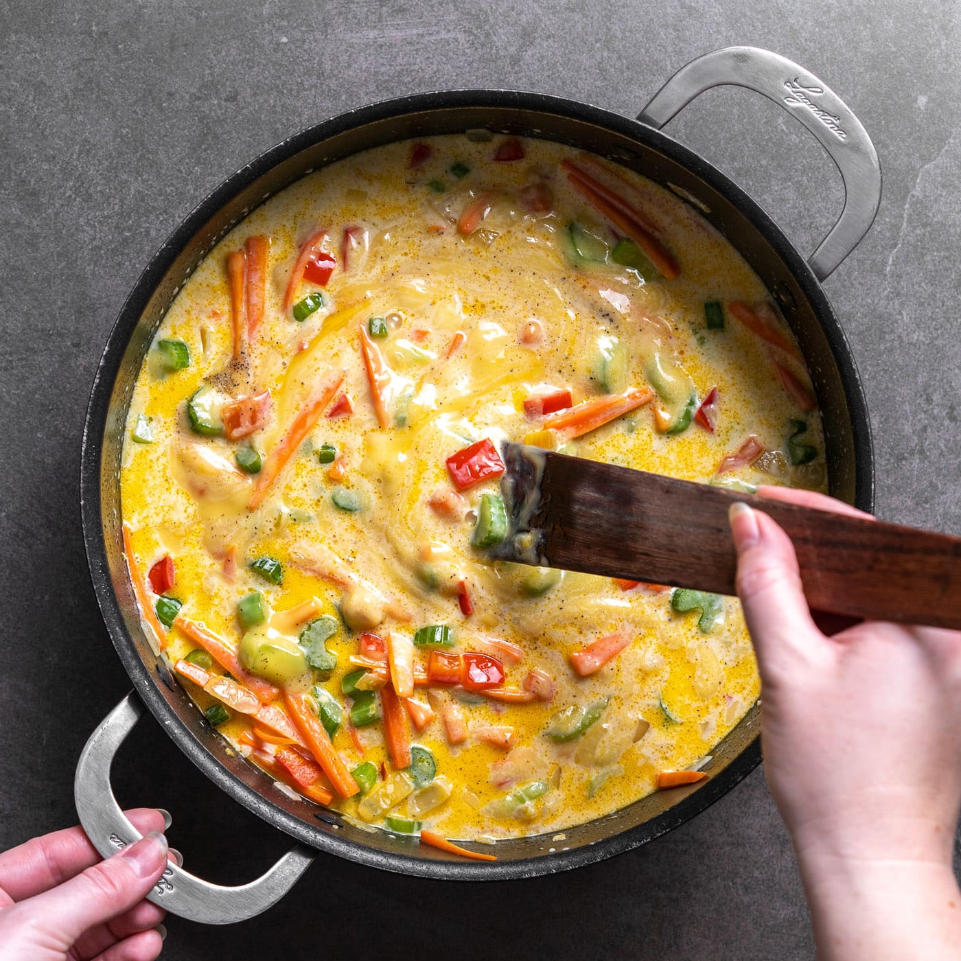 stirring chicken chow mein casserole sauce in a pan