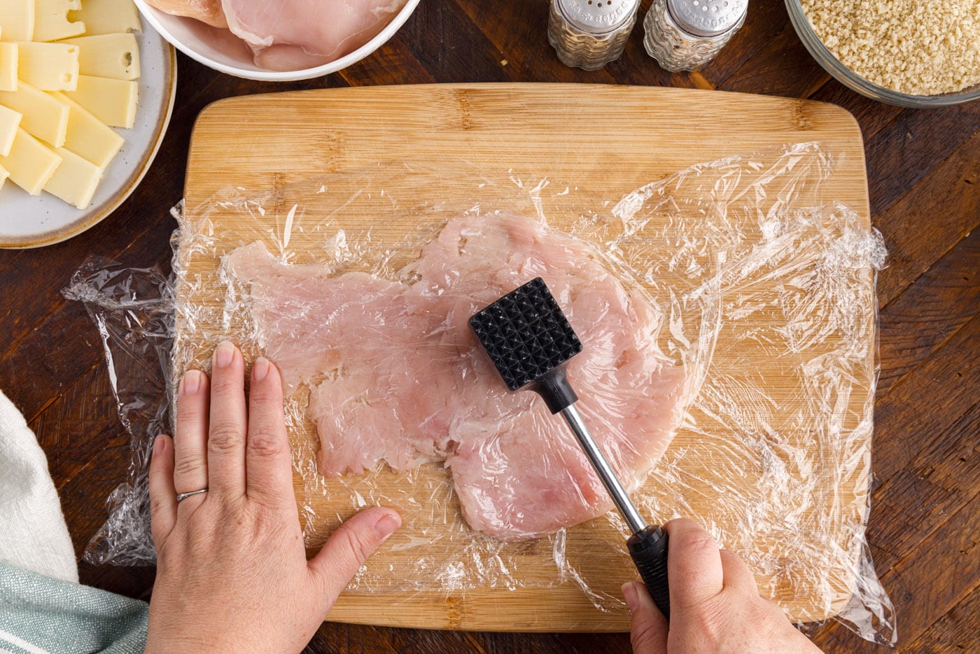 pounding chicken breast with meat tenderizer