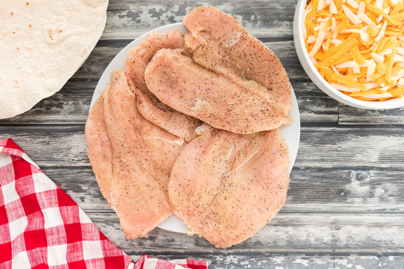 butterflied chicken breasts seasoned with salt and pepper